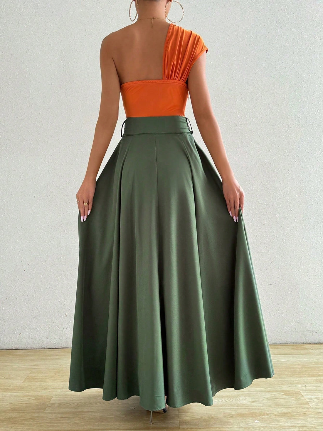 Get ready for a chic and colorful beach vacation with our maxi dress! Featuring a trendy asymmetrical neckline, front slit and knot detail, this dress will make you stand out in the sun. Perfect for a fun and stylish getaway, don't forget to pack this must-have dress!