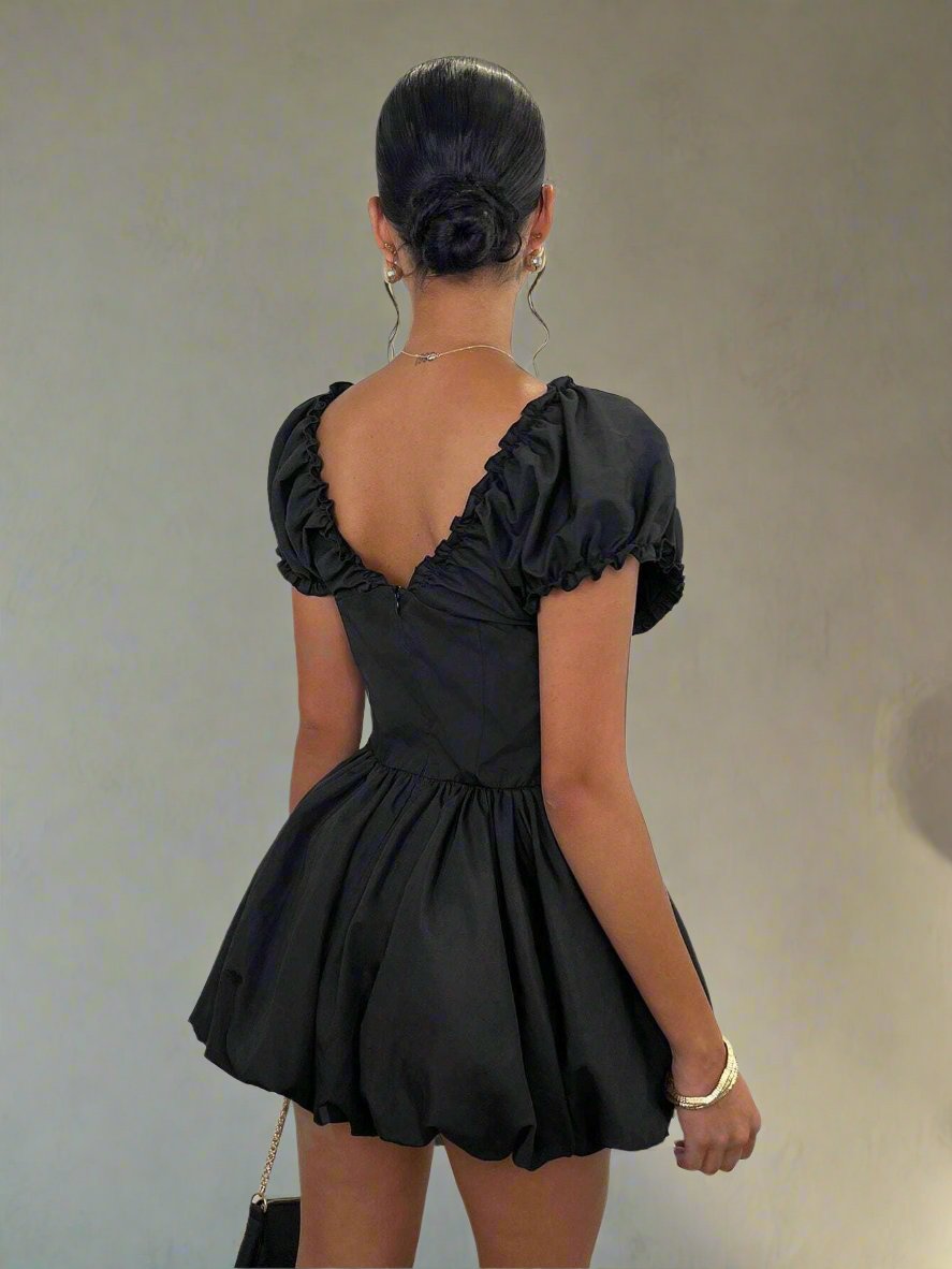 Elevate your style with our Elegant Black Sweetheart Mini Dress. Its flattering sweetheart neckline and chic design make it perfect for parties and vacations. Made with high-quality fabric, this dress offers both comfort and style. Make a statement in this versatile piece that will never go out of fashion.