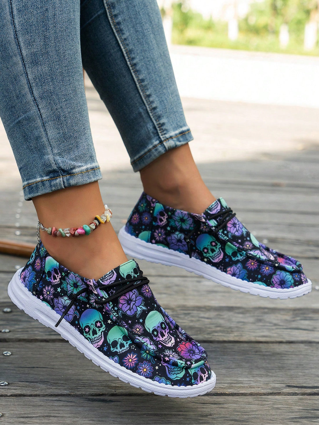 Step into spooky style with these Halloween-themed women's canvas sneakers. Featuring a striking black and blue floral pattern accented by a bold skull design, they bring festive flair to your footwear. Lightweight and crafted with a non-slip sole, these sneakers keep you comfortable and steady whether you're trick-or-treating or just showing off your seasonal spirit. Perfect for adding a playful edge to your fall wardrobe!