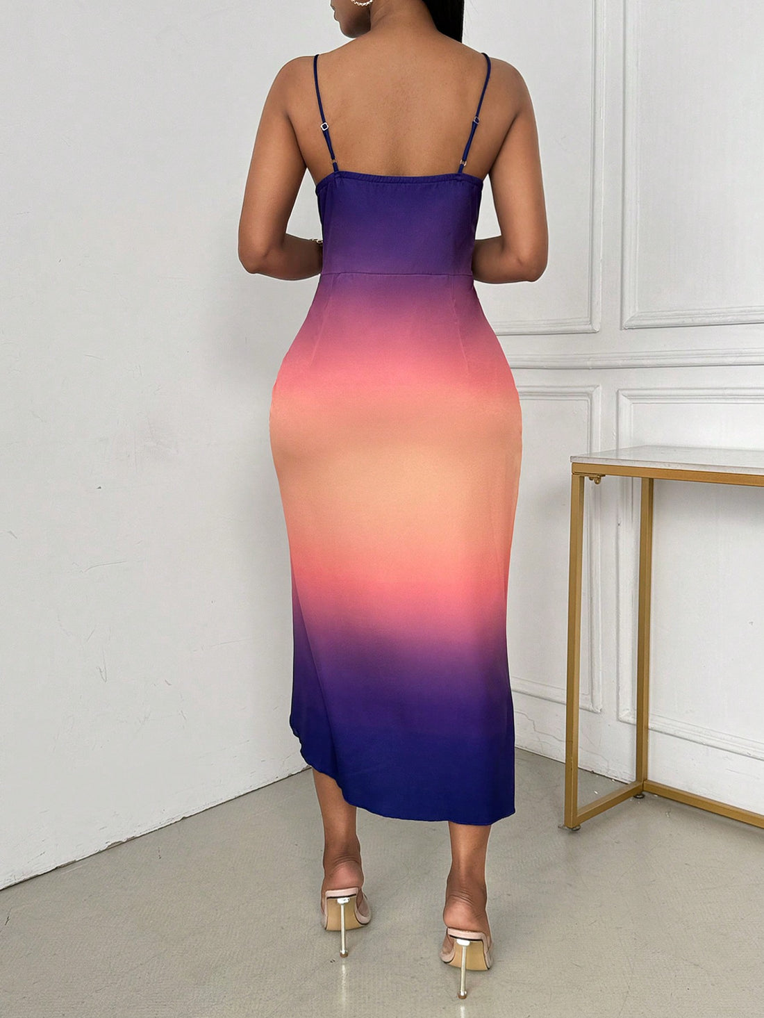 Elevate your style with our Gradient Print Bodycon Dress. The sleek and stylish design features pleats and a slit, making it perfect for any occasion. The gradient print adds a touch of uniqueness, while the bodycon fit flatters your figure. Make a statement with this must-have dress.