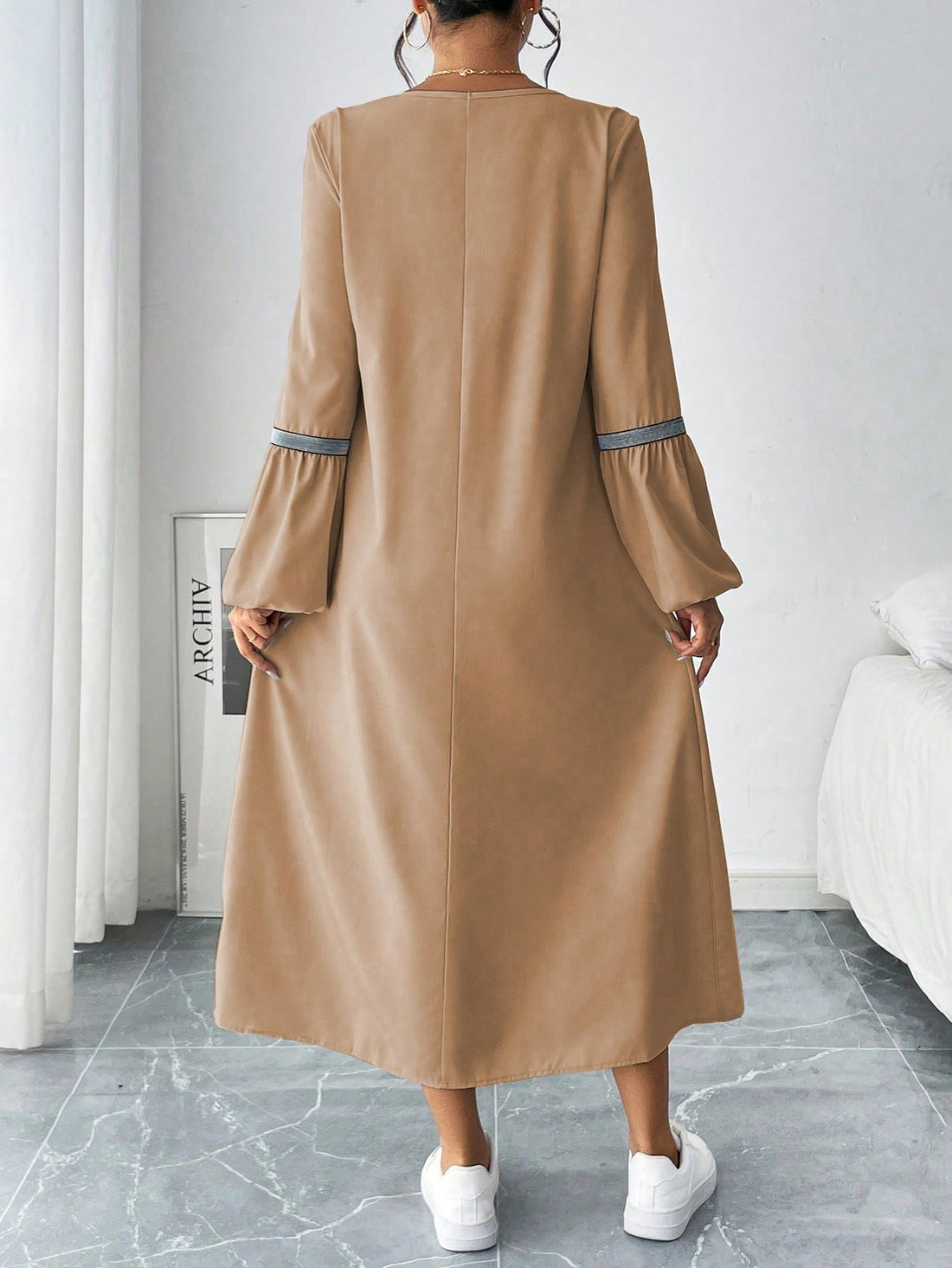 This dress is the ultimate blend of style and comfort. With its elegant woven belt and unique design, you'll turn heads while feeling at ease. Perfect for any occasion, this dress proves that fashion and comfort can coexist.