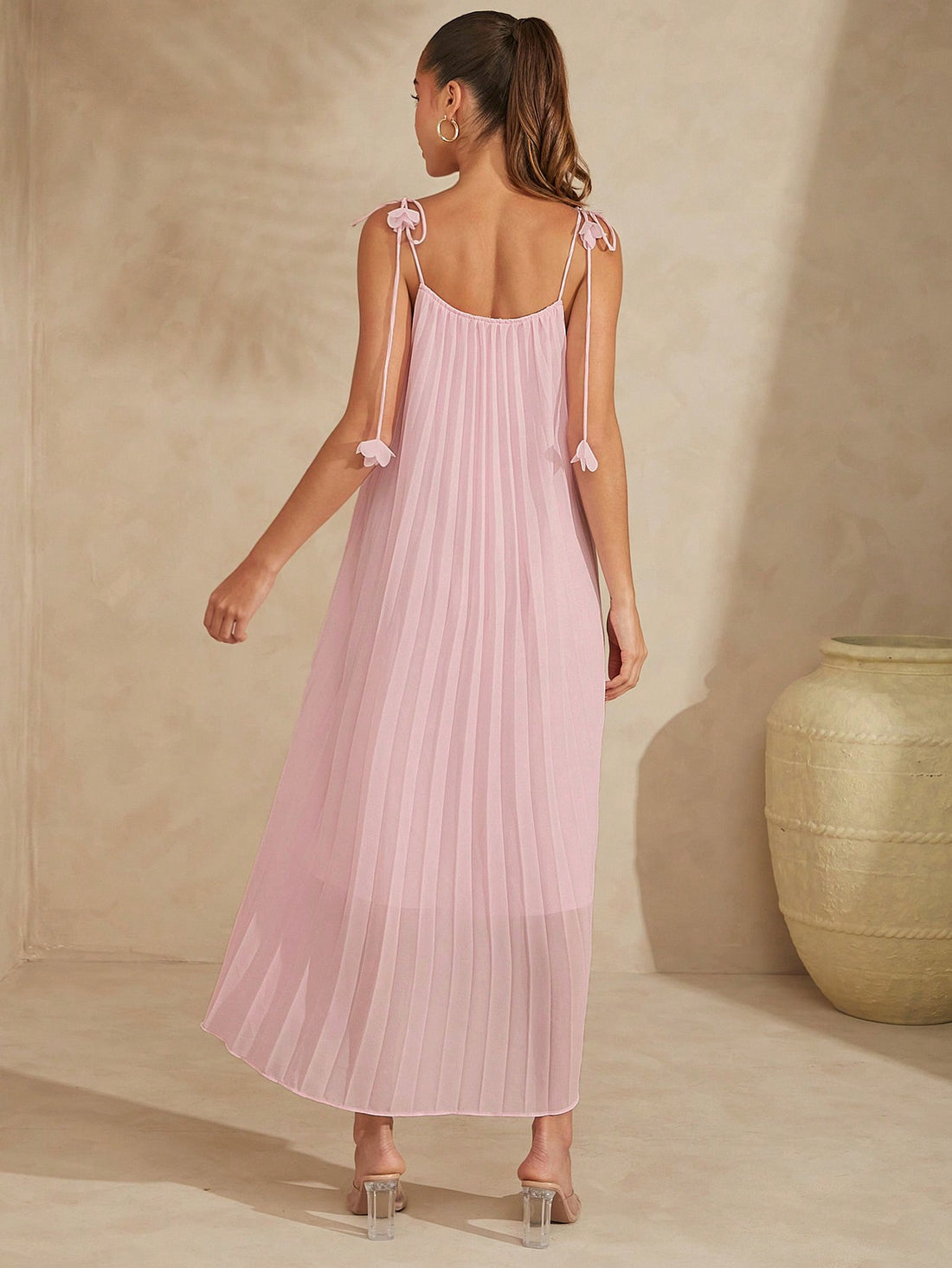 Elevate your summer style with our Elegant Pleated 3D Flower Maxi Dress! The delicate pleats and 3D flower design add a touch of elegance, while the strap tie detail adds a playful twist. Perfect for those who like to stand out from the crowd!