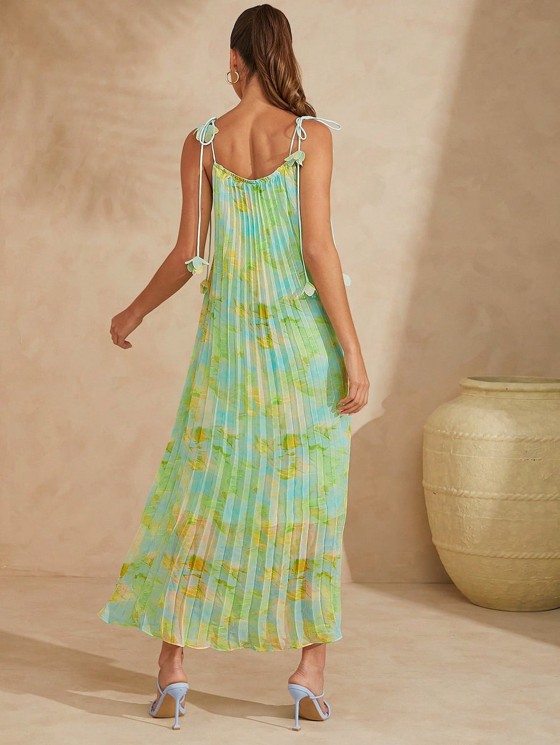 Experience effortless elegance with our Haute Summer Vacation Printed Pleated Slip Dress. Perfect for any summer vacation, this dress features a lightweight and flowy fabric that will keep you cool in the heat. The pleated design adds a touch of sophistication, making you the most stylish person on your trip.
