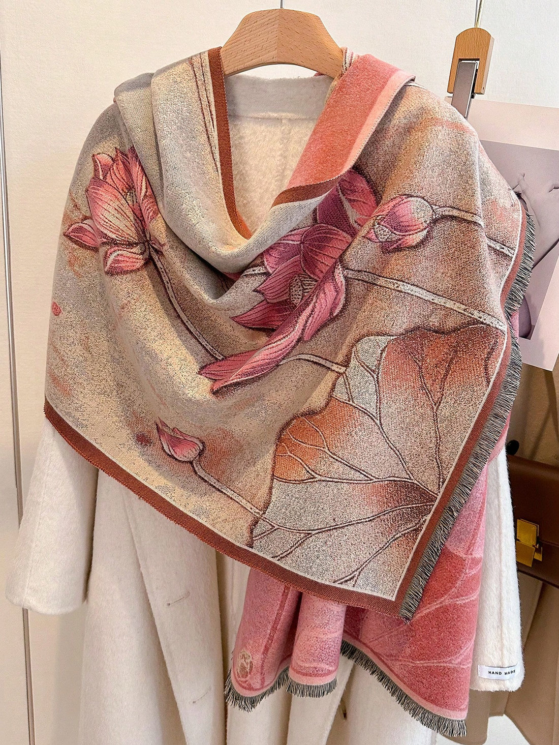 Introducing our luxurious Lotus Floral Bliss Imitation Cashmere Scarf, the must-have fashion accessory for the Fall/Winter season. Made with soft and durable imitation cashmere, this versatile scarf features a beautiful lotus floral design that will elevate any outfit. Stay warm and stylish with this essential piece.
