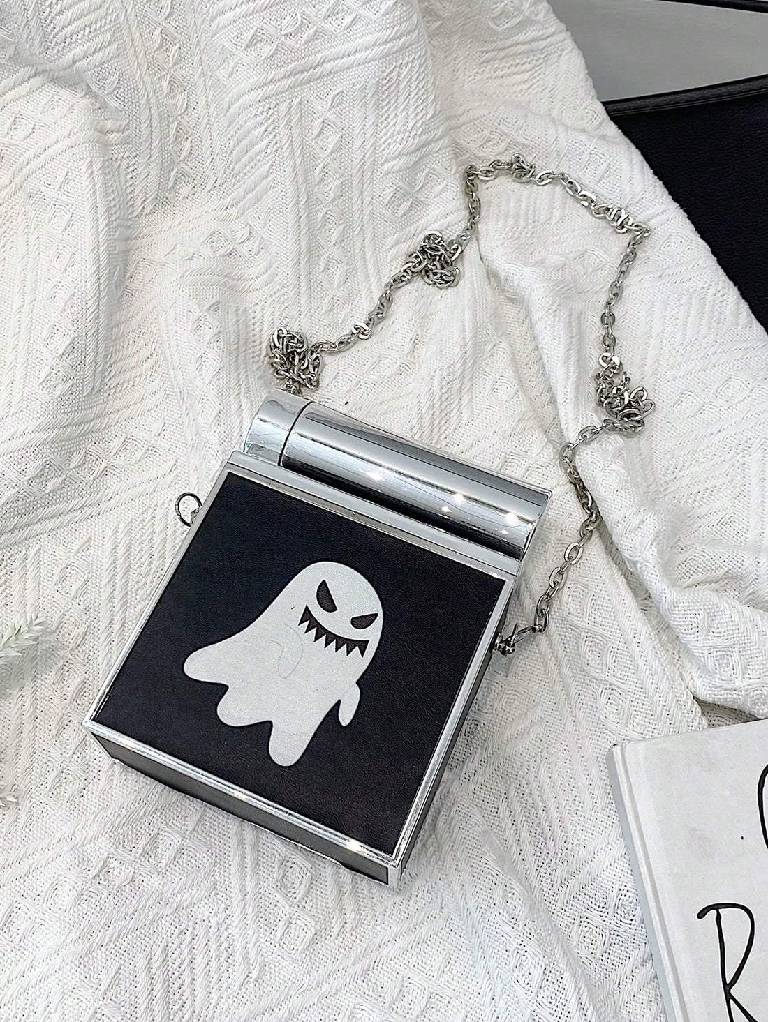 This Gothic Glamour chain crossbody bag set is perfect for the Halloween season. Made from high-quality materials, this unique bag set features a gothic design that will add a touch of edginess to any outfit. The gold chain adds a touch of luxury and the set includes multiple bags for added versatility.