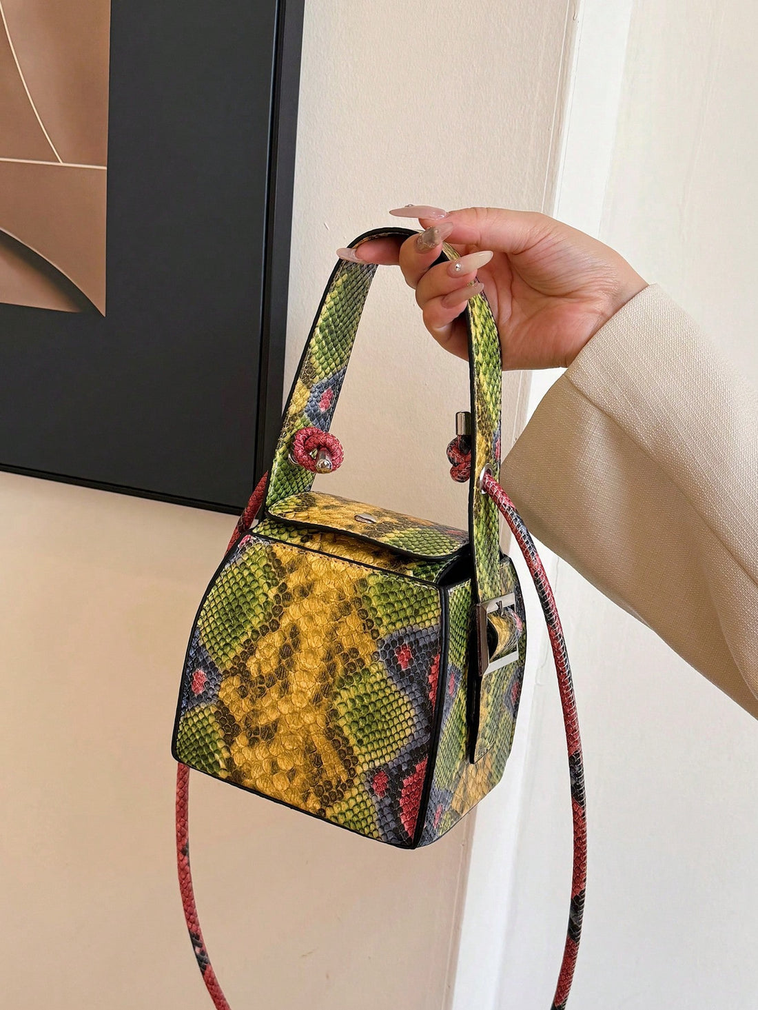 Add a touch of modern elegance to your wardrobe with our Chic Mini Yellow Snake Print Cube Handbag. Expertly crafted with stylish snake print and a unique cube shape, this handbag is perfect for any occasion. Stay trendy and organized with this versatile shoulder bag.