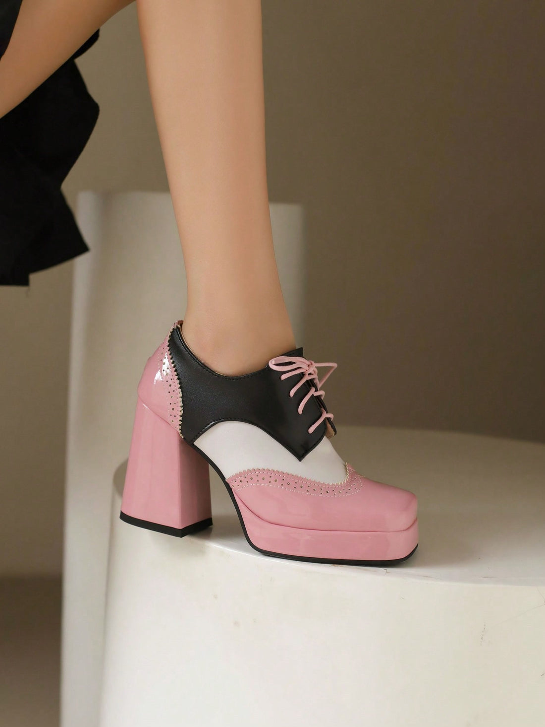 Elevate your holiday style with our Sultry Lace-Up Brogue Mary Jane Heels. With their sophisticated lace-up design and classic brogue detailing, these heels add a touch of vintage charm to any outfit. Perfect for a stylish Christmas, step into these heels and make a statement at any holiday event.