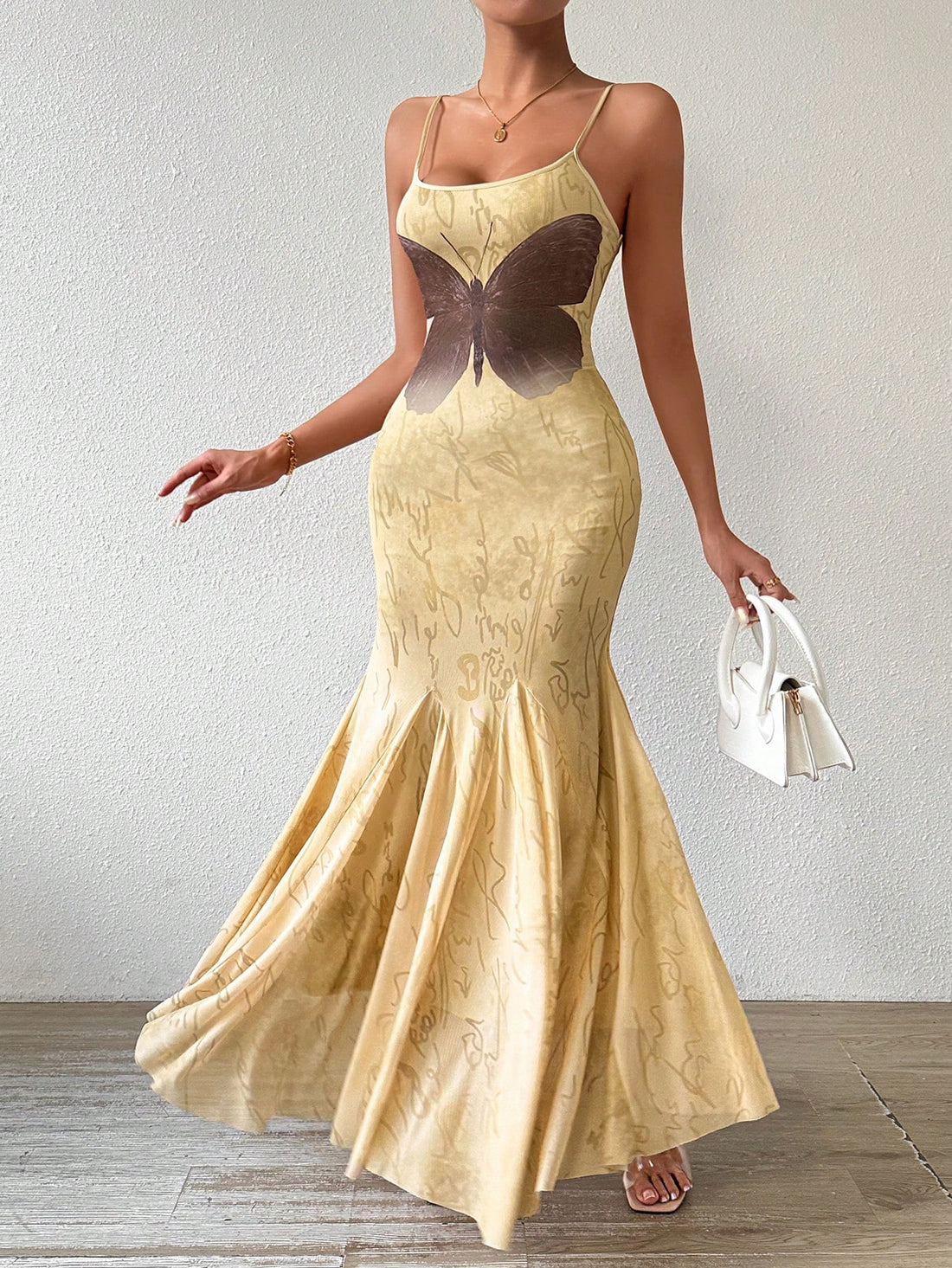 Elevate your style with our Chic Vintage Elegance Butterfly Print Bodycon Fishtail Dress. Made with high-quality materials, the dress features a unique butterfly print and a flattering bodycon fit. Perfect for any occasion, this dress will make you stand out with its elegance and vintage charm.