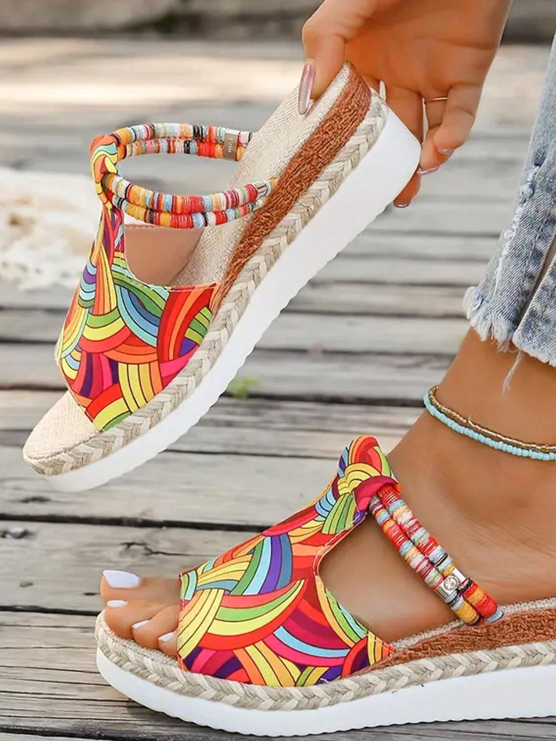 Add a splash of color to your summer wardrobe with our Colorful Woven Platform Wedge Sandals. These stylish sandals not only offer a fun and unique design, but also provide comfort and support with their platform wedge. Elevate your style while remaining comfortable all season long.