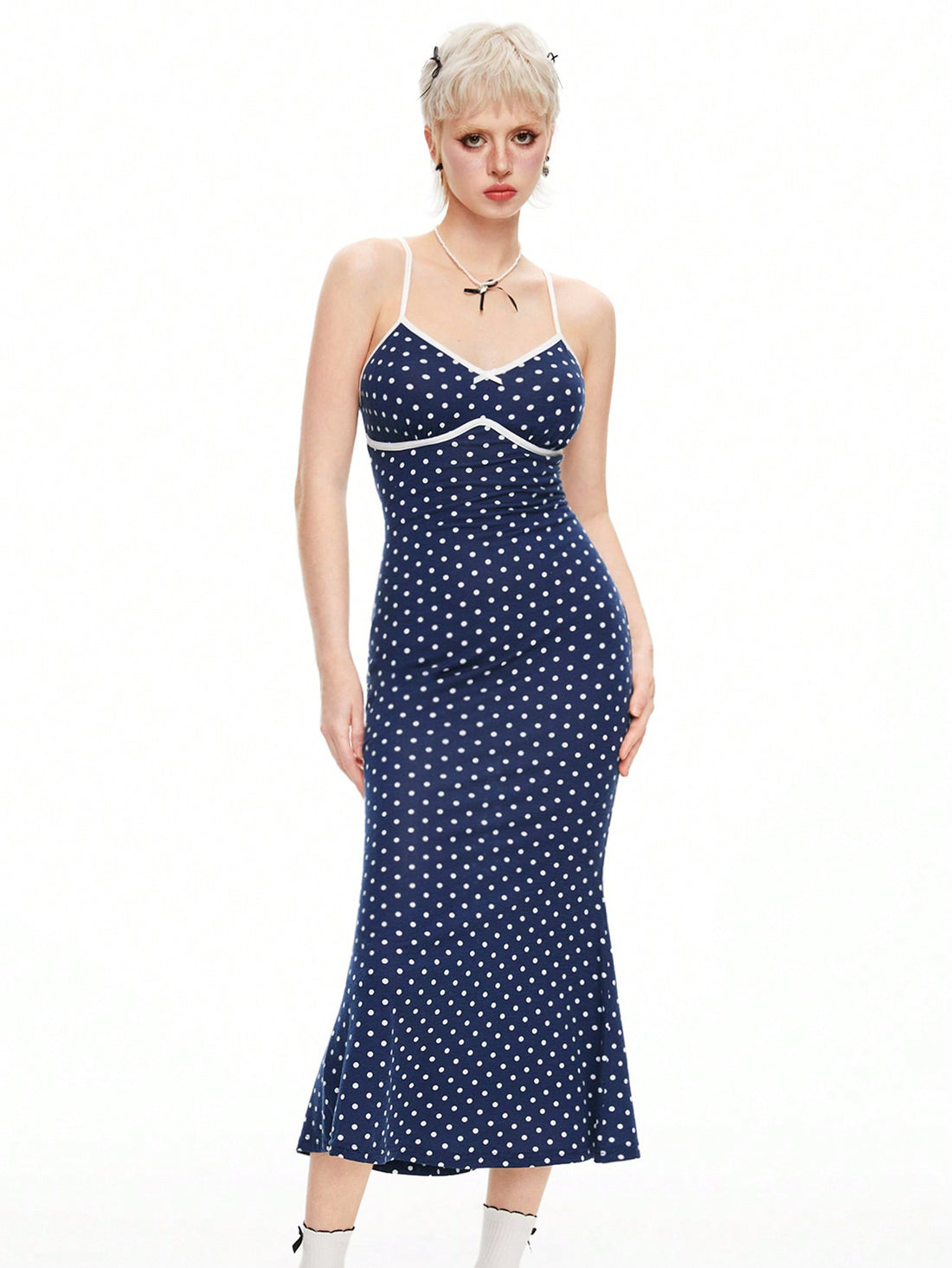 Twirl into your day with this adorable polka dot spaghetti strap dress that's equal parts cute and chic. The delicate spaghetti straps and playful dot pattern create a kawaii-inspired look that's perfect for casual outings, coffee dates, or whenever you want to feel effortlessly put-together. Lightweight and comfortable, this dress transitions seamlessly from day to night, making it a wardrobe essential for anyone who loves a touch of whimsy with their style.