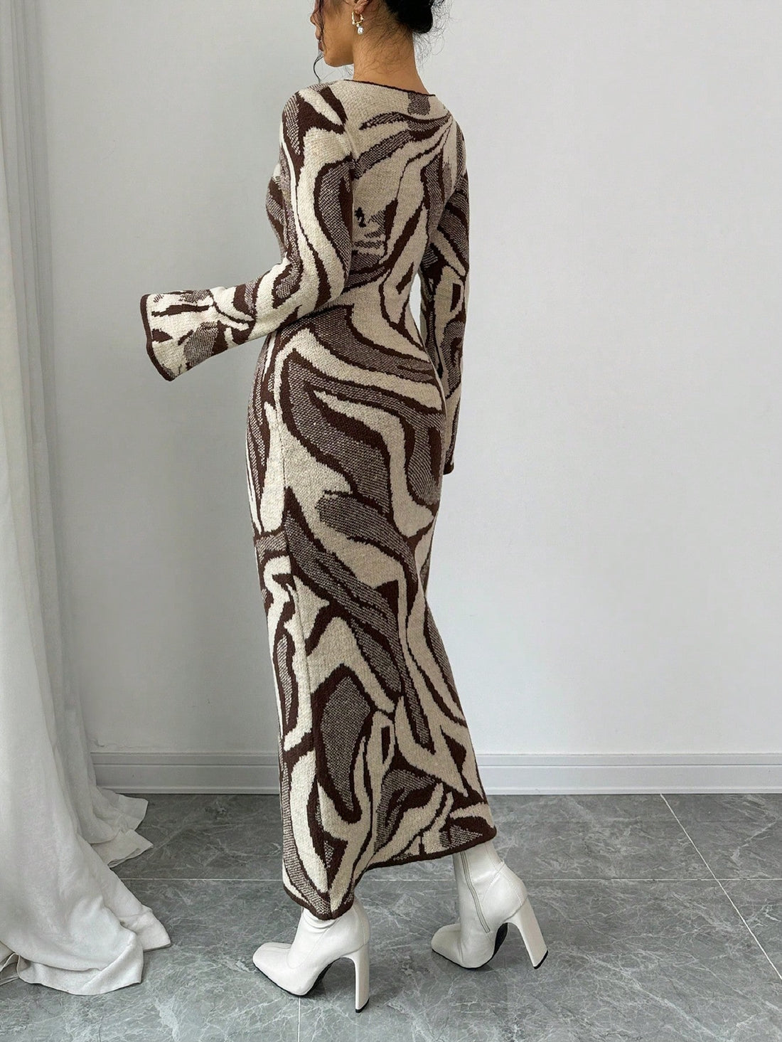 Elevate your cold-weather wardrobe with this chic knit sweater dress that effortlessly transitions from cozy nights in to stylish outings. The fitted silhouette flatters your figure while dramatic flare sleeves add a playful twist that catches every eye. Crafted from soft, quality knit fabric, it's your go-to piece for autumn and winter layering or standalone wear. Dress it up with boots and jewelry or keep it casual with sneakers—this versatile beauty works for every vibe you're channeling.