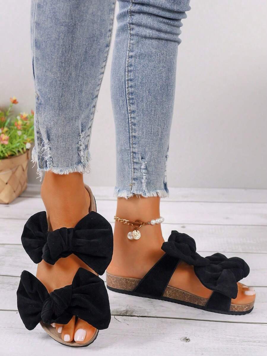 Step into summer with these Chic Women's Bowknot Flat Sandals! Designed for comfort and style, their playful bowknot detail adds a fun twist to your casual look. Perfect for sunny days, these flats keep your feet happy while turning heads wherever you go. Easy to slip on and light to wear, they’re your new go-to for effortless summer vibes.