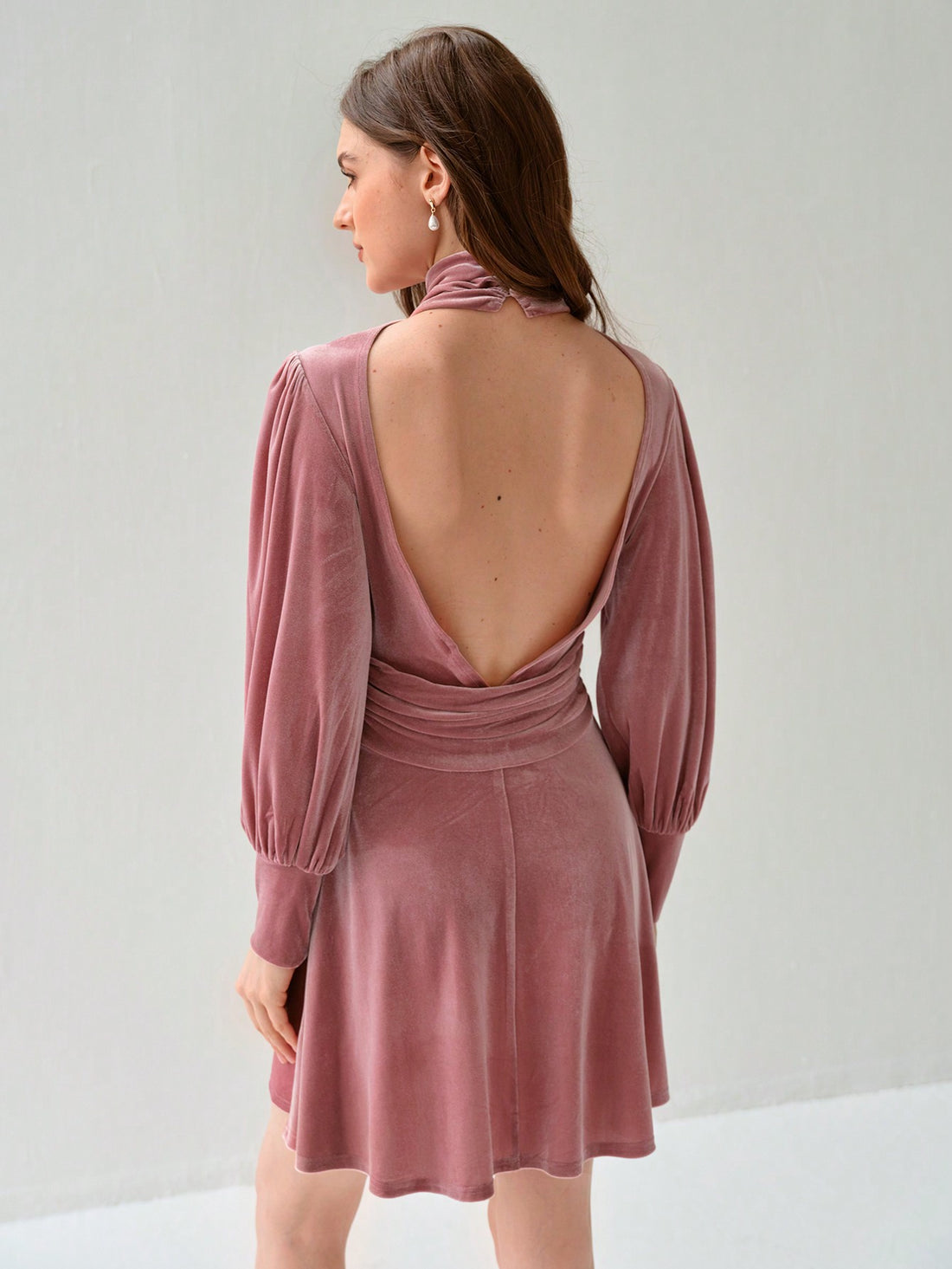 Introducing our Chic Elegance dress, a stylish option for women seeking a stand-out look. The solid color and pleated design add a touch of sophistication, while the stand collar and long sleeves provide a unique twist. Perfect for any occasion, this dress exudes charm and elegance.