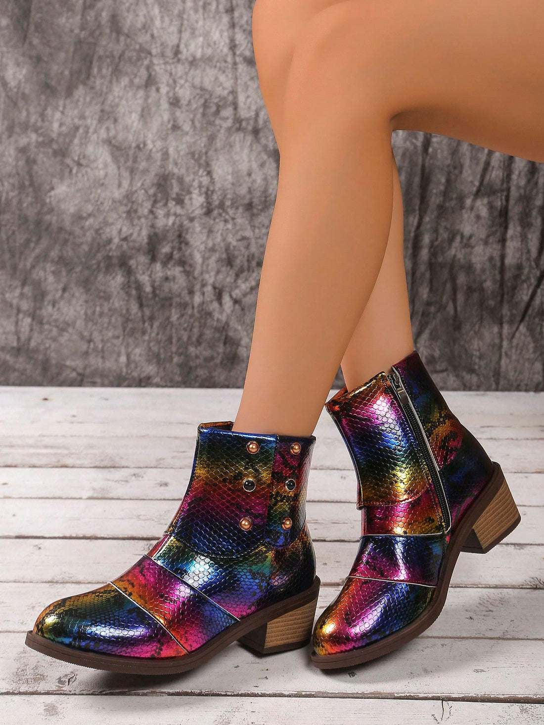 Introduce some unique style to your wardrobe with our Colorful Snake Pattern Chunky Heel Ankle Boots. With vibrant colors and a trendy snake pattern, these boots will make you stand out in any crowd. Their chunky heel provides both comfort and stability, making them the perfect choice for a night out on the town. Show off your fashion sense with these stylish ankle boots.