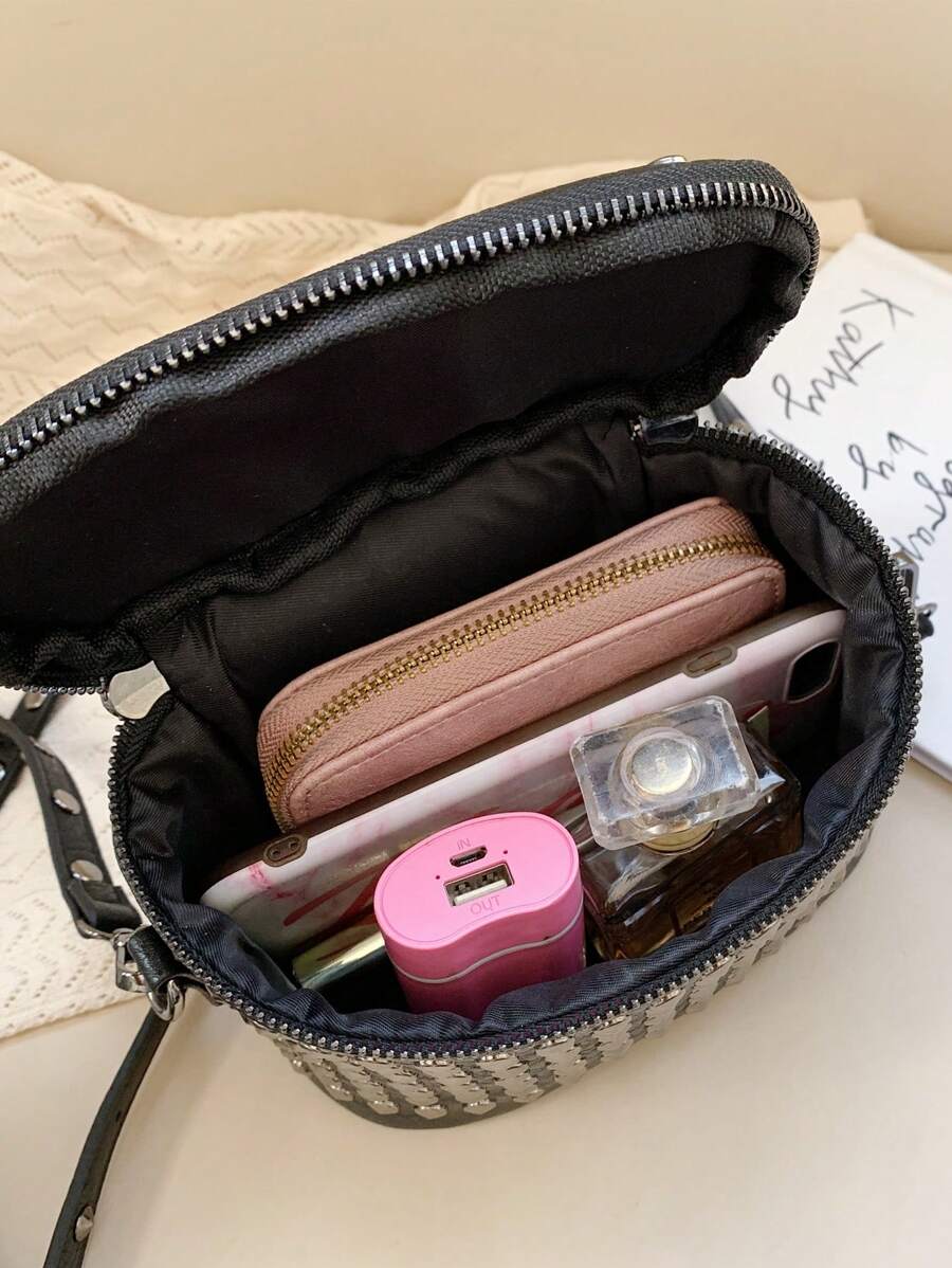 Make a statement with this edgy mini box bag that's all attitude and zero apologies. Featuring bold asymmetric styling and eye-catching studs, it's the perfect accessory for anyone ready to embrace their punk-rock side. The compact shoulder silhouette keeps things practical while the solid color base lets those metallic details steal the show. Whether you're heading to a night out or adding edge to your everyday look, this bag brings the cool factor without trying too hard.