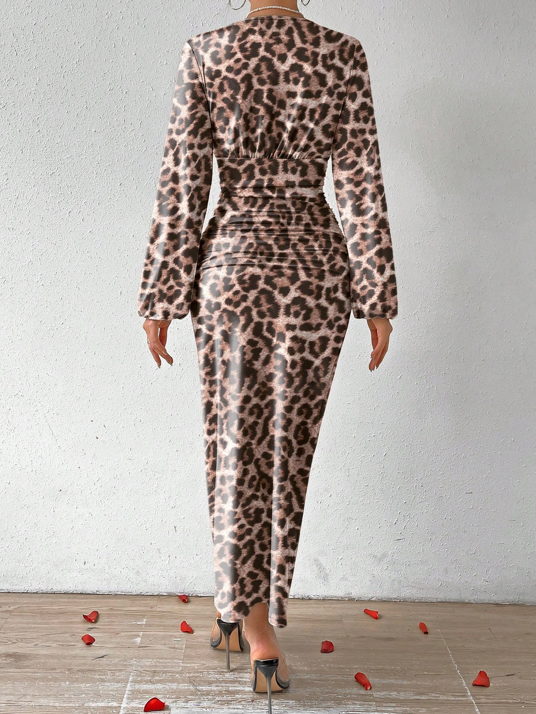 This elegant dress is perfect for fall events. Its chic V-neckline and leopard print make a stylish statement, while the ruched puff sleeves add a touch of sophistication. Make a lasting impression with this must-have dress.