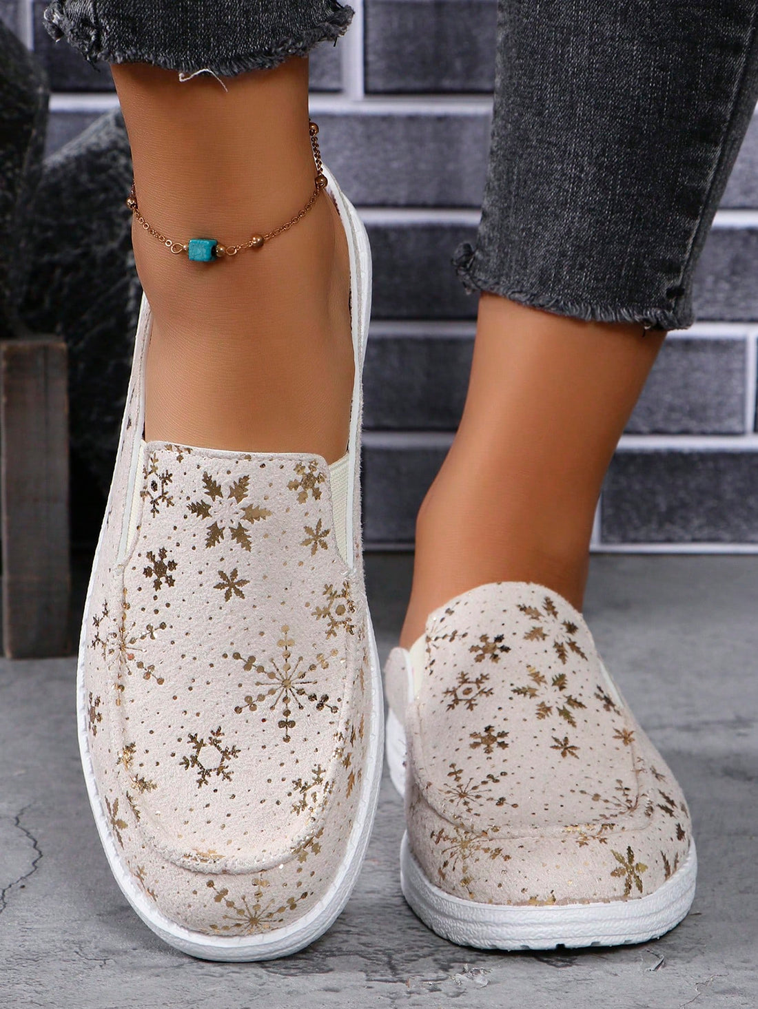 Introducing our Sparkling Snowflake Slip-Ons - the perfect blend of style and comfort. With a sporty design and sparkling snowflake embellishments, these casual shoes are sure to make a statement. Slip them on for a touch of glam to any outfit.