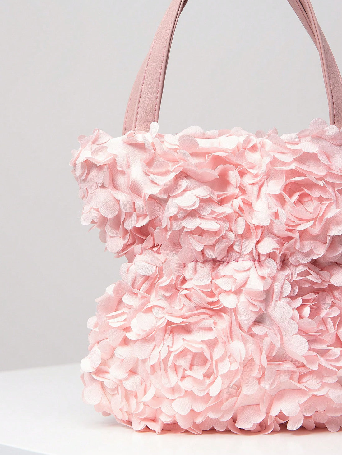 Introducing the Chic Floral Evening Clutch - the perfect handbag for weddings and parties. With its elegant design and floral detailing, this clutch will add a touch of sophistication to any event. Its compact size makes it convenient to carry without compromising on style.