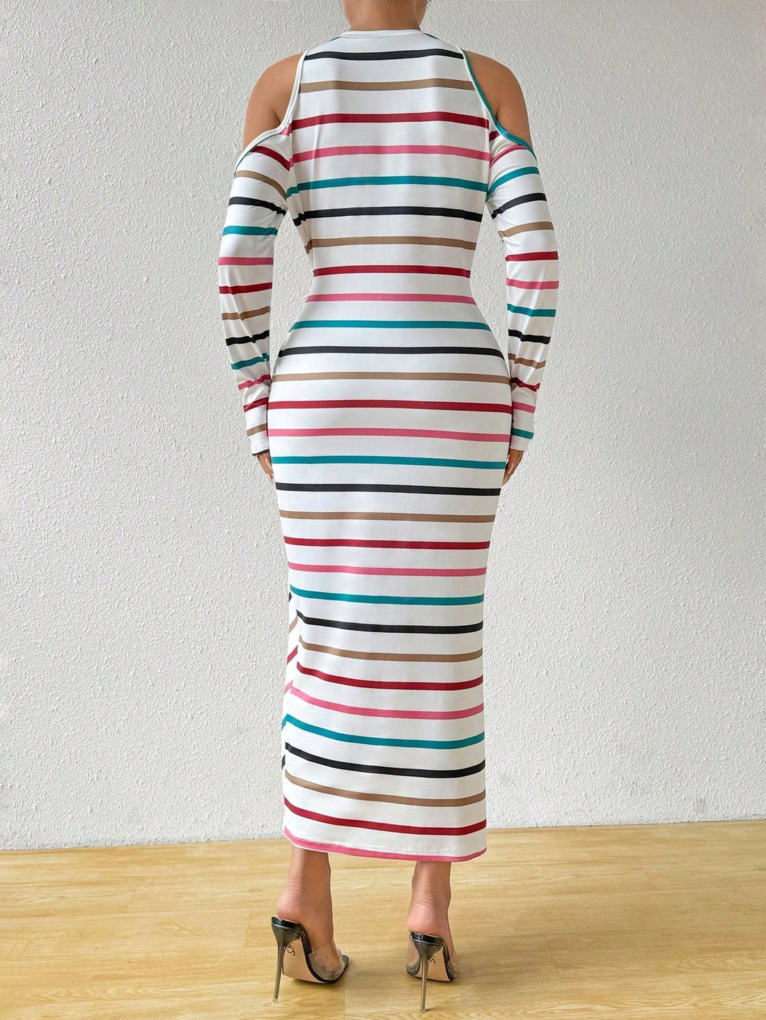 This stylish midi dress features chic stripes, open shoulders, and a tie waist, making it the perfect choice for any spring or autumn occasion. With its on-trend design and comfortable fit, this dress is sure to elevate your style and keep you looking and feeling confident.