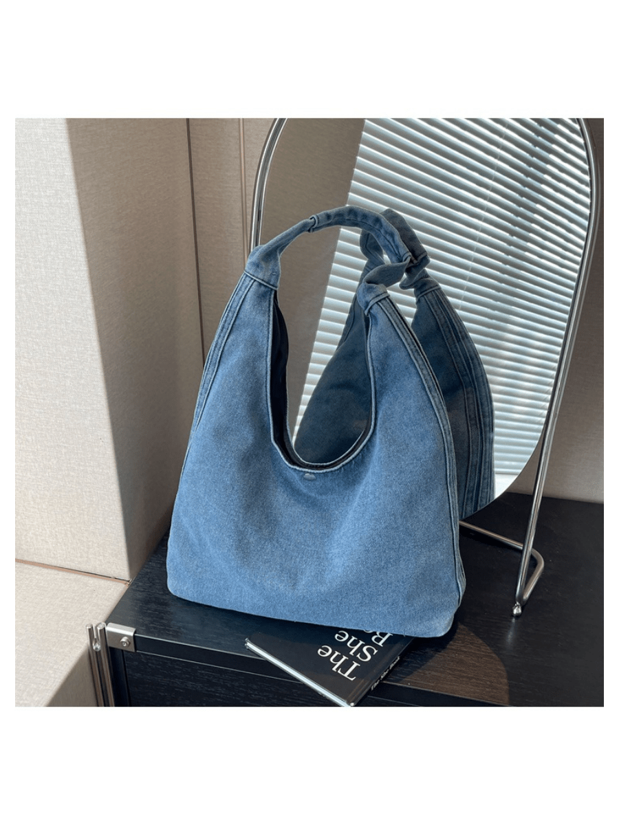 Meet your new go-to sidekick for every casual outing—the Trendy Denim Crescent Shoulder Bag! With its slouchy hobo shape and cool denim vibe, this purse brings effortless style to your college days and weekend adventures. Spacious enough to hold all your essentials, it’s the perfect mix of playful charm and practical comfort. Sling it over your shoulder and step out with confidence and laid-back flair!