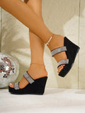 Angled view of black suede-like rhinestone wedge sandals with chunky platform sole