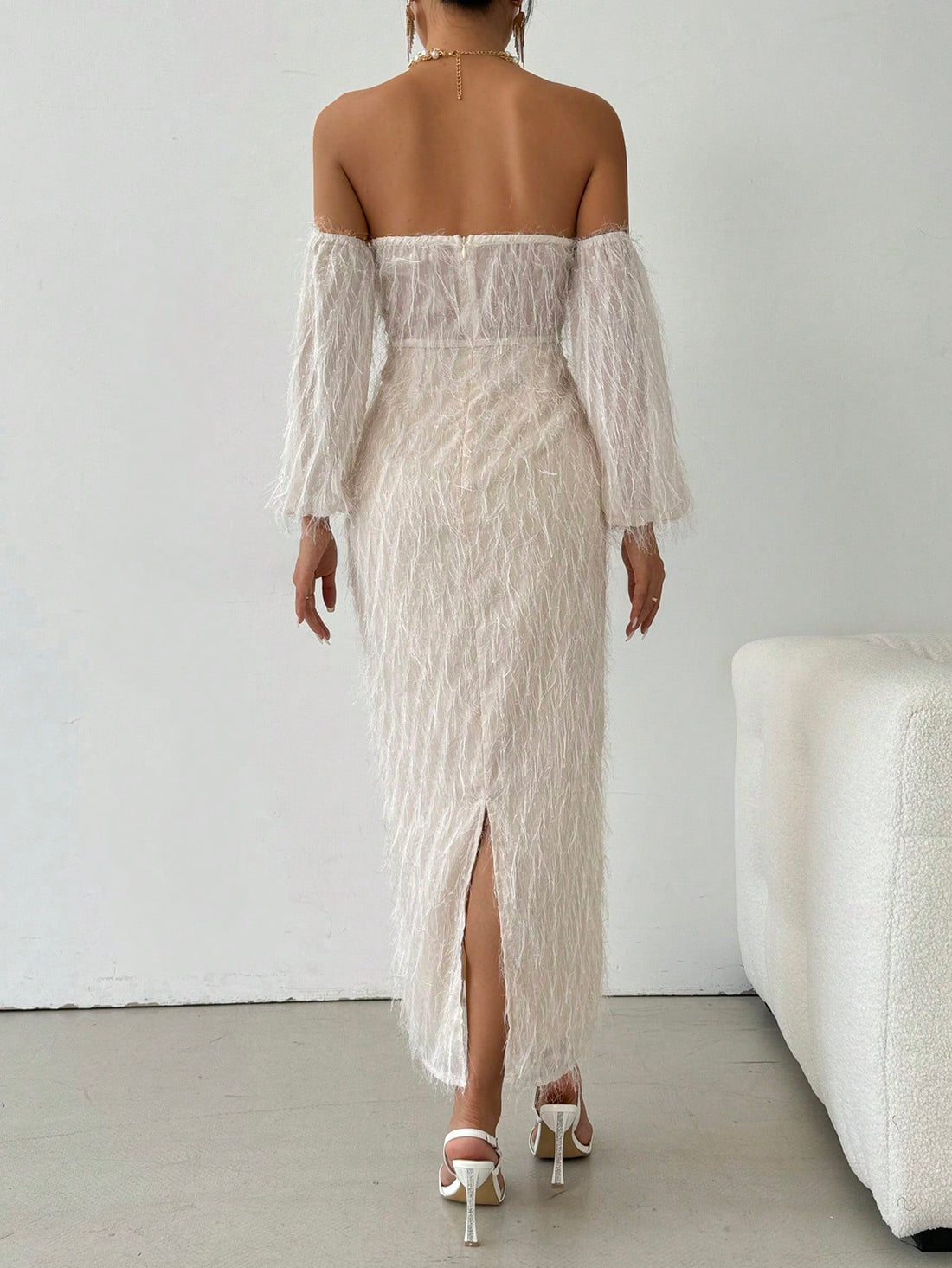 Experience cozy elegance with our Off-Shoulder Furry Long Sleeve Fitted Dress. The soft, furry material and off-shoulder style provide both comfort and style. Perfect for any occasion, this dress will keep you warm and fashionable.