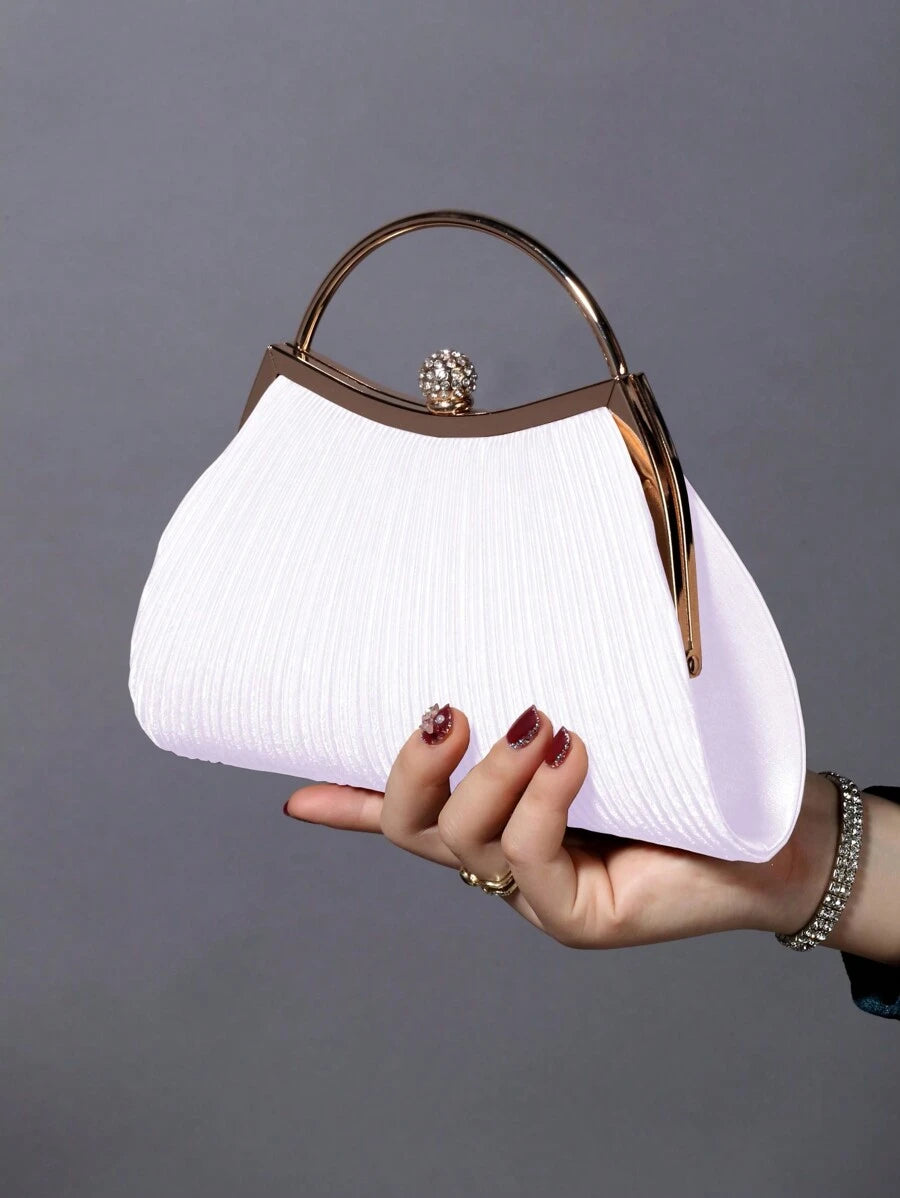 Elevate your evening ensemble with this stunning rhinestone clutch, meticulously crafted to capture light and attention. Featuring hand-placed rhinestone embellishments across a sleek silhouette, this bag delivers sophisticated glamour for weddings, galas, and upscale celebrations. The compact design fits essentials while the secure closure keeps your valuables protected. Versatile enough to complement formal gowns or cocktail dresses, this clutch transforms any special occasion into a moment of refined ele