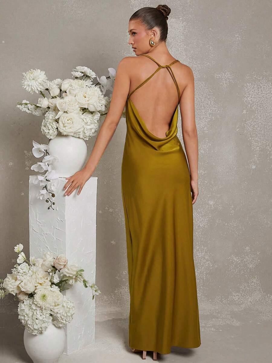 Step into summer celebrations with this Elegant Floral Chiffon Backless Maxi Dress, designed to turn heads at any wedding. Its light, flowing chiffon keeps you cool while the backless detail adds a flirty touch. Perfect for dancing under the sun or stars, this dress blends comfort with charm—making you the guest everyone admires.