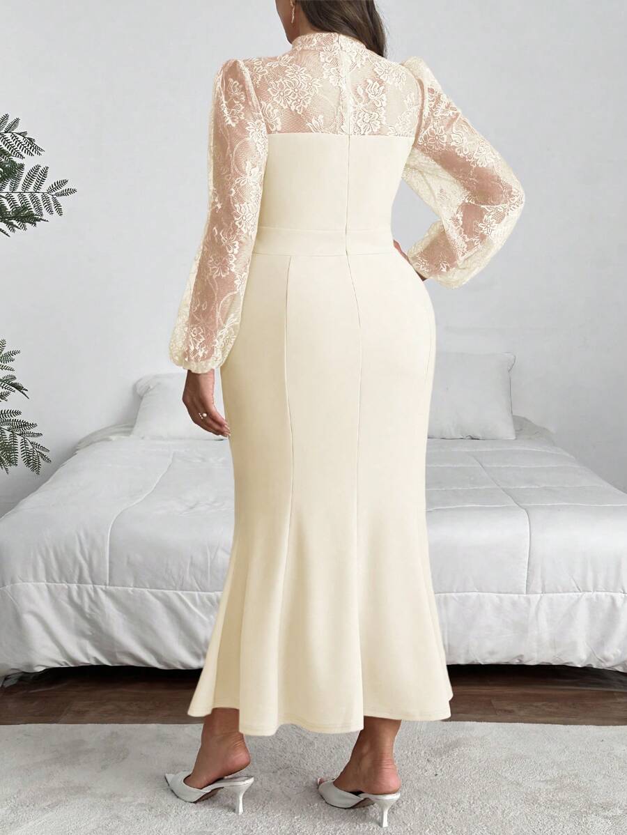 Make a statement at your graduation with this stunning plus-size dress that combines timeless elegance with modern flair. The delicate lace splice detail adds sophistication, while the dramatic mermaid hem creates a show-stopping silhouette. Playful lantern sleeves bring movement and dimension to the design, flattering your figure with style. Perfect for celebrating your big moment in confidence and grace.