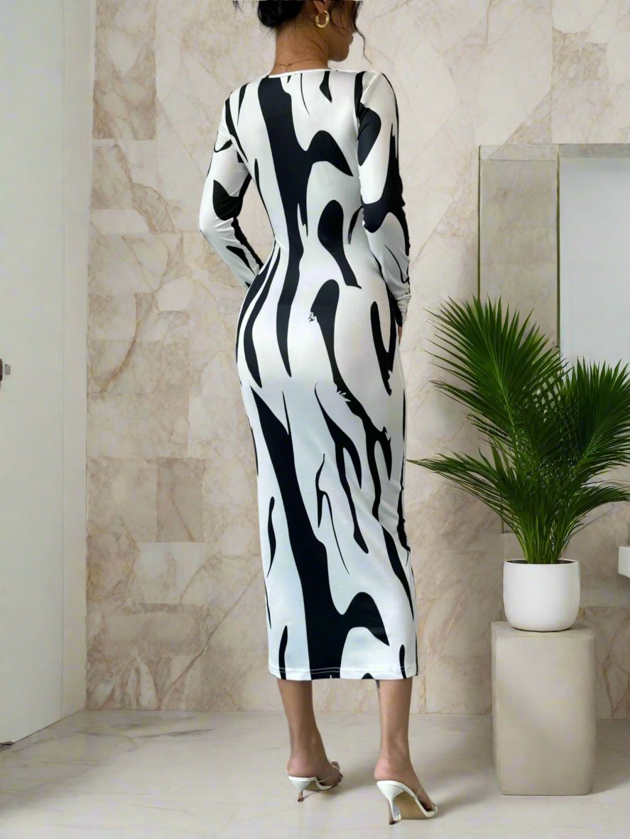 Experience the perfect balance of elegance and charm with our Enchanted Elegance: Asymmetrical Print Bodycon Midi Dress. With its unique print and flattering bodycon fit, this dress will make you feel confident and stylish. Crafted with premium materials, it offers both comfort and sophistication. Elevate your wardrobe with this timeless piece today.
