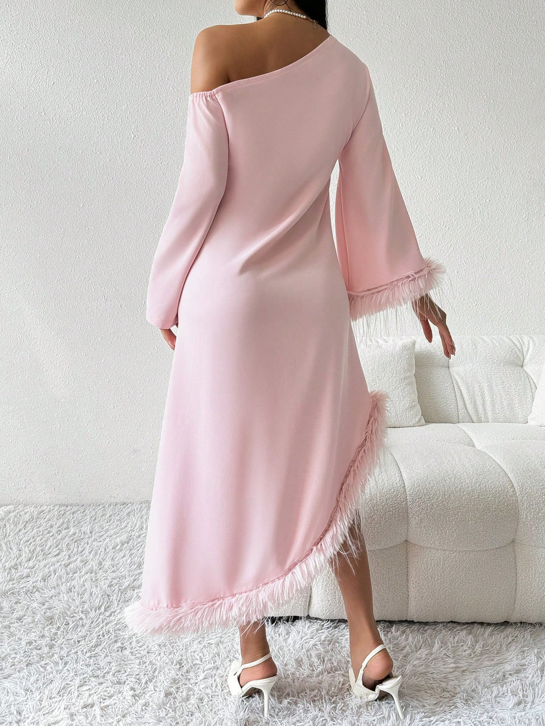 Elevate your wardrobe with our Chic Asymmetrical Knit Dress. This stylish piece features fuzzy cuffs for a touch of sophistication and effortless elegance. The asymmetrical design adds a unique twist to a classic dress, making it perfect for any occasion. Stay stylish and comfortable with our chic dress.