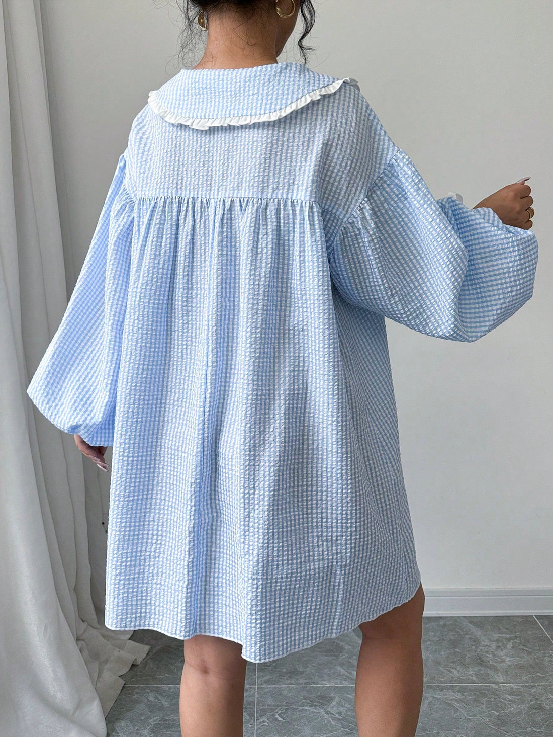 Look chic and fashionable this autumn in our A-Line dress that features a trendy plaid print. The ruffle collar and lantern sleeves add a touch of elegance to this must-have dress. Stay comfortable and stylish all season long.