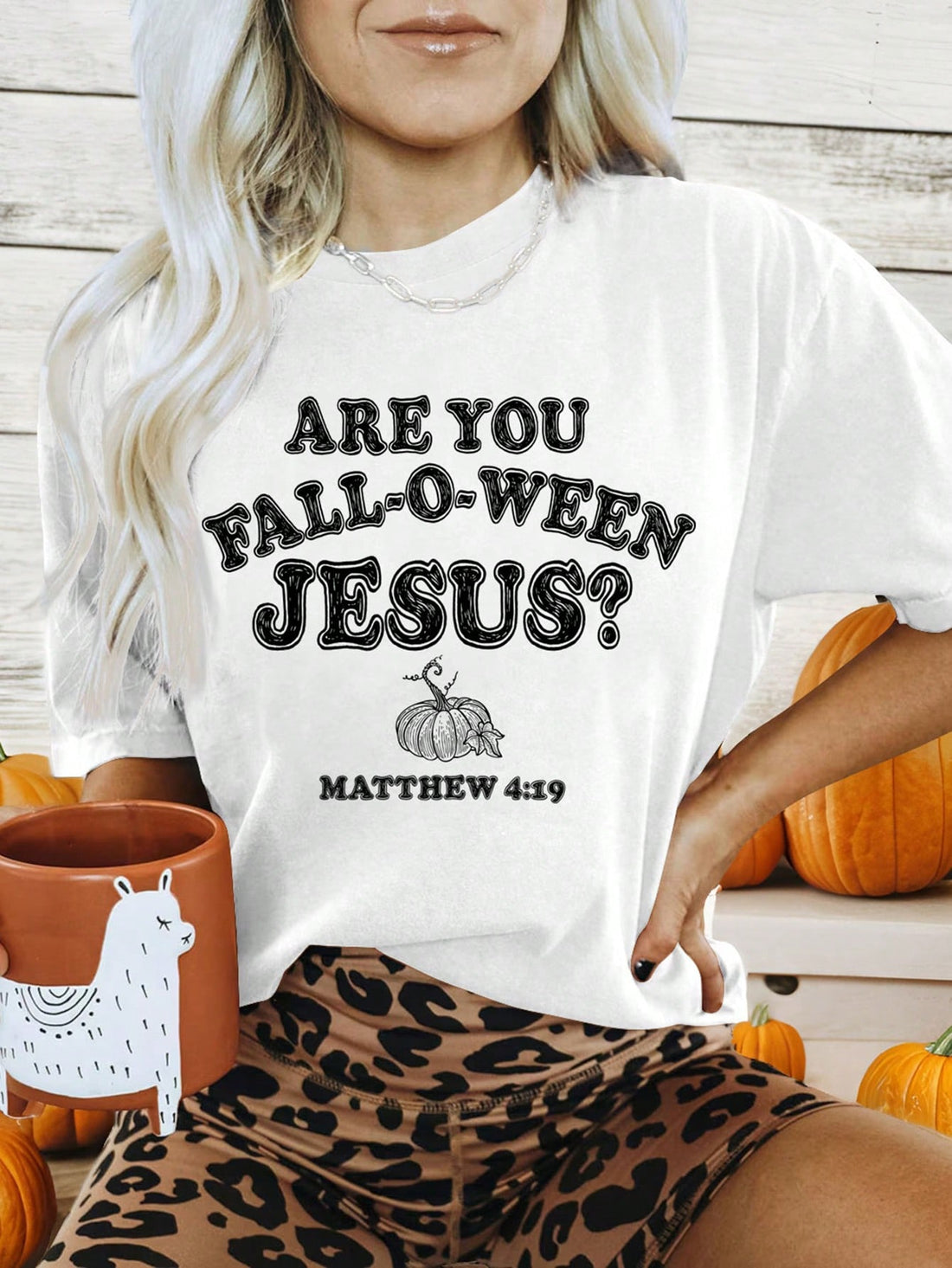 Elevate your Halloween wardrobe with our Spooktacular Style: Black Pumpkin Graphic Tee for Women. Crafted with soft, high-quality fabric, this tee features a bold black pumpkin graphic that adds a touch of spooky fun. Perfect for any Halloween gathering or casual outing, it's a must-have for any fashion-forward woman.