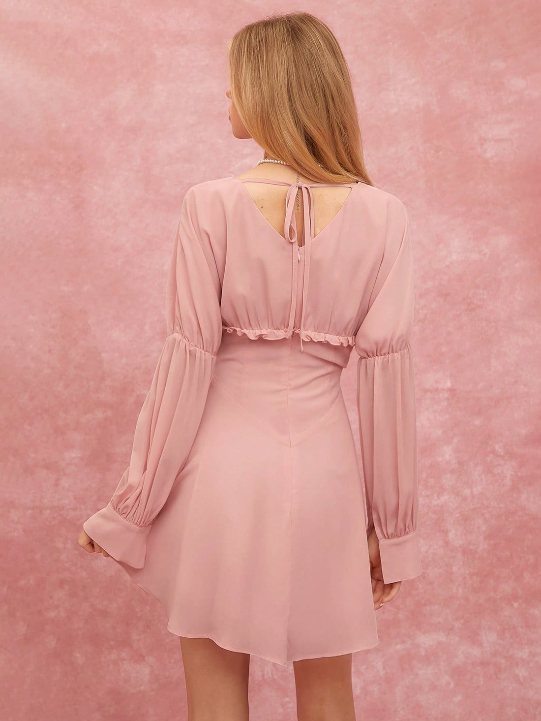 Effortlessly exude style in our Chic & Charming V-Neck Ruffle Hem Mini Dress. A flirty v-neck and playful ruffle hem add a touch of charm to this versatile dress. Perfect for any occasion, this dress is sure to be a staple in your wardrobe.