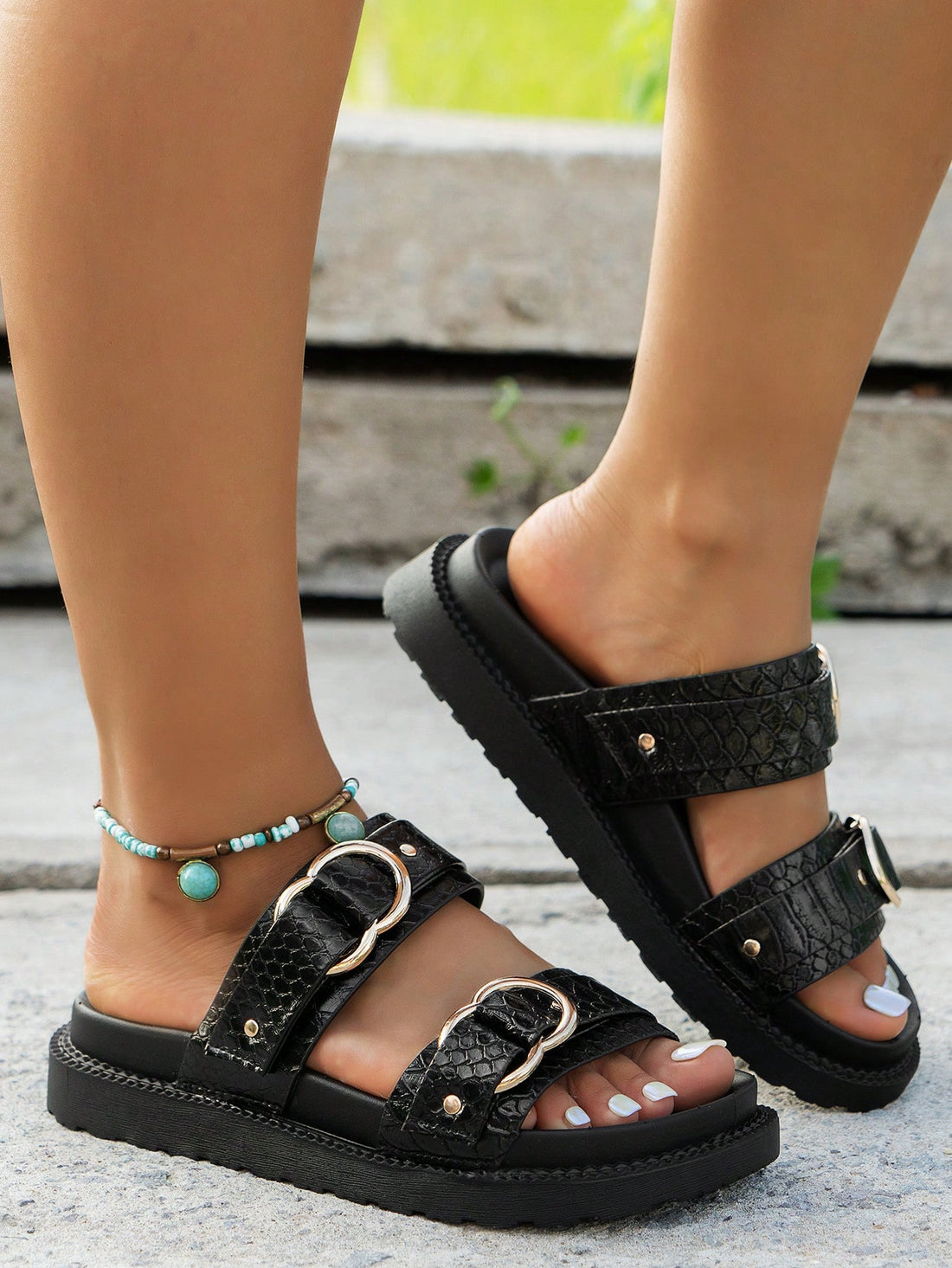 Step out in style with these black crocodile-embossed flat sandals, featuring shiny gold double buckles for a touch of glam. Designed for ultimate comfort, they’re perfect for all-day wear without sacrificing flair. Slip them on and let your feet do the talking!