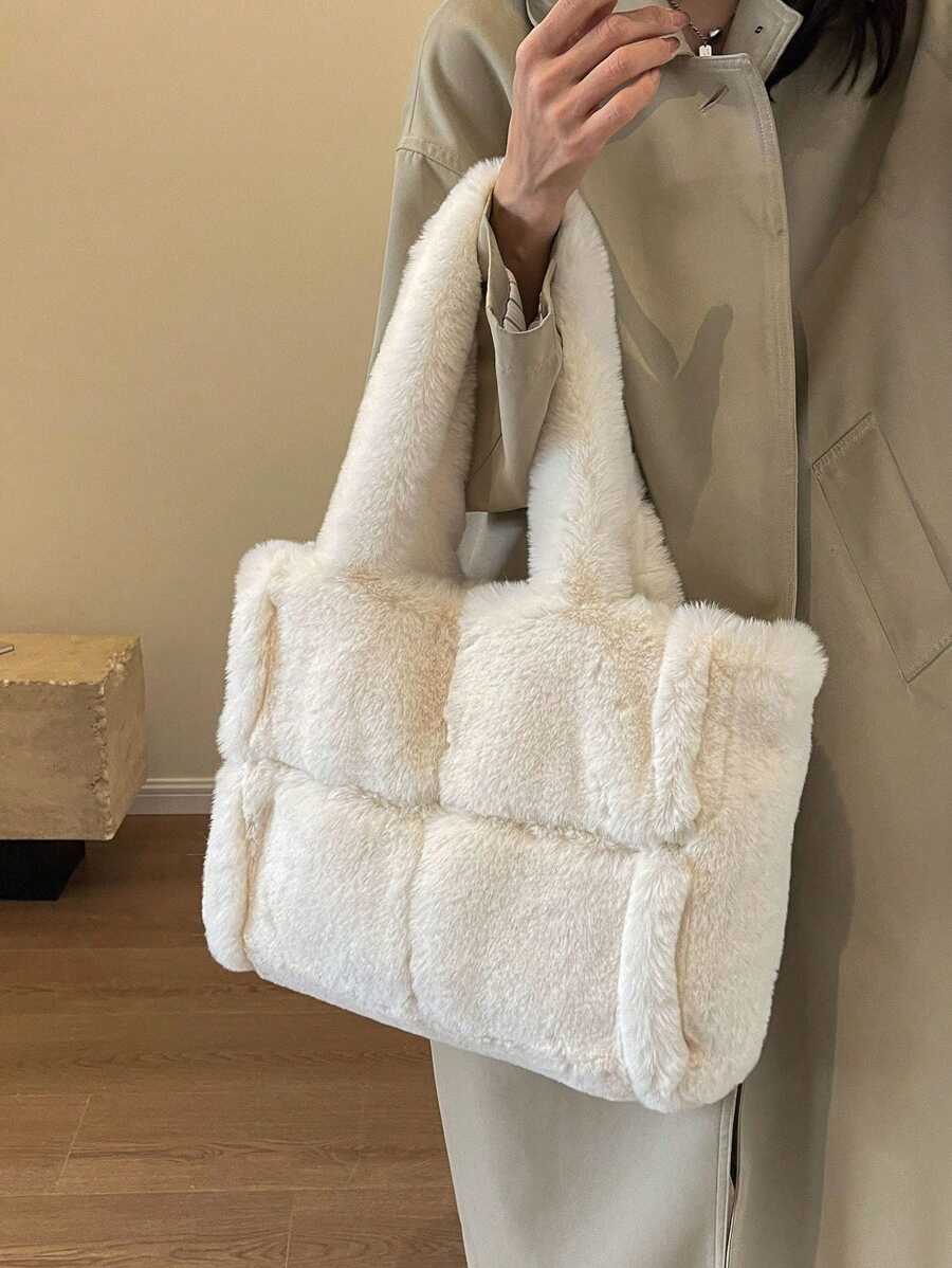 Carry your essentials in style with this dreamy beige plush tote—the perfect companion for everything from coffee runs to campus adventures. Soft to the touch and generously spacious, it's designed for those who love minimalist vibes without sacrificing functionality. Whether you're heading to class, the office, or weekend errands, this shoulder bag keeps your hands free and your look effortlessly chic. The neutral tone pairs with literally any outfit, making it your new go-to for daily adventures.