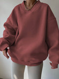 Front view of red oversized V-neck sweatshirt with rib-knit cuffs and hem