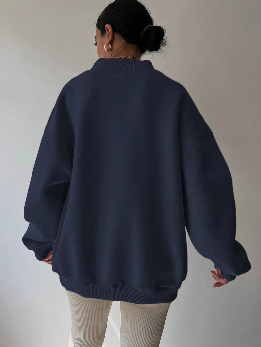 Back view of navy blue oversized sweatshirt with wide rib-knit hem and cuffs