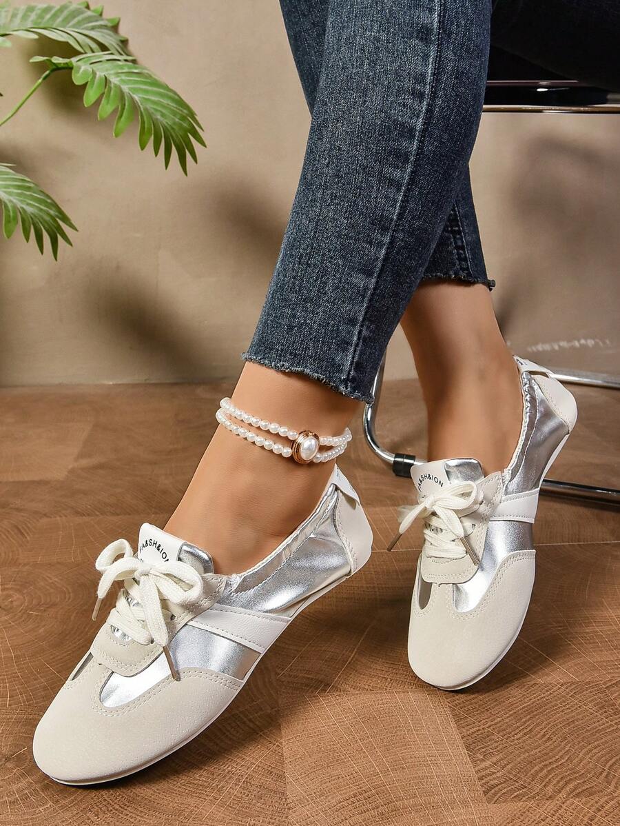 Step into timeless elegance with these charming lace-up ballet flats. Designed with a soft, flexible bottom that moves with your feet, they deliver all-day comfort without compromise. The retro-inspired lacing detail adds a touch of vintage sophistication, while the sleek silhouette pairs effortlessly with skirts, dresses, and casual everyday outfits. Whether you're heading to the office or out for a leisurely weekend, these flats are your go-to choice for understated style that never goes out of fashion.