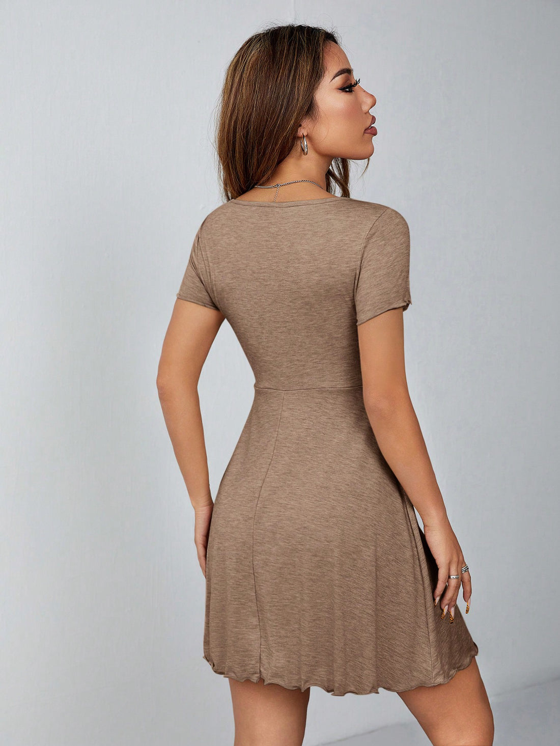 Elevate your summer style with our Chic Petite Lettuce Trim Drawstring Knot Front Summer Dress in Classic Black. Its unique design is both chic and classic, featuring delicate lettuce trim and a trendy drawstring knot front. Look effortlessly stylish and feel confident all season long!