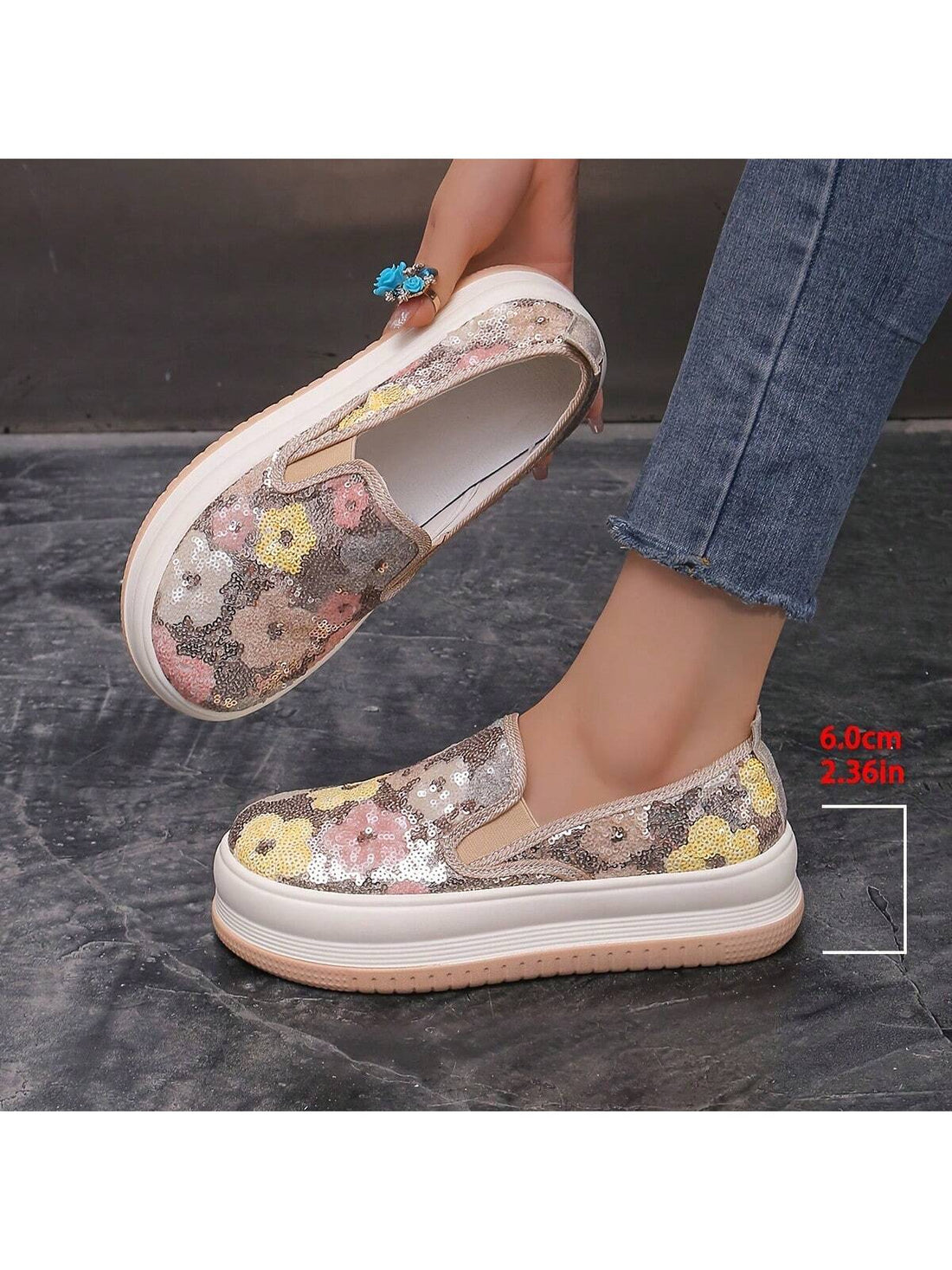 Step into spring with a splash of sparkle! These glittering metallic flower platform slip-ons combine comfort and pizzazz for your casual wardrobe. The eye-catching floral embellishments add a fun pop to everyday outfits, while the canvas construction keeps your feet happy all day long. Slip them on and transform even your simplest summer looks into something special!