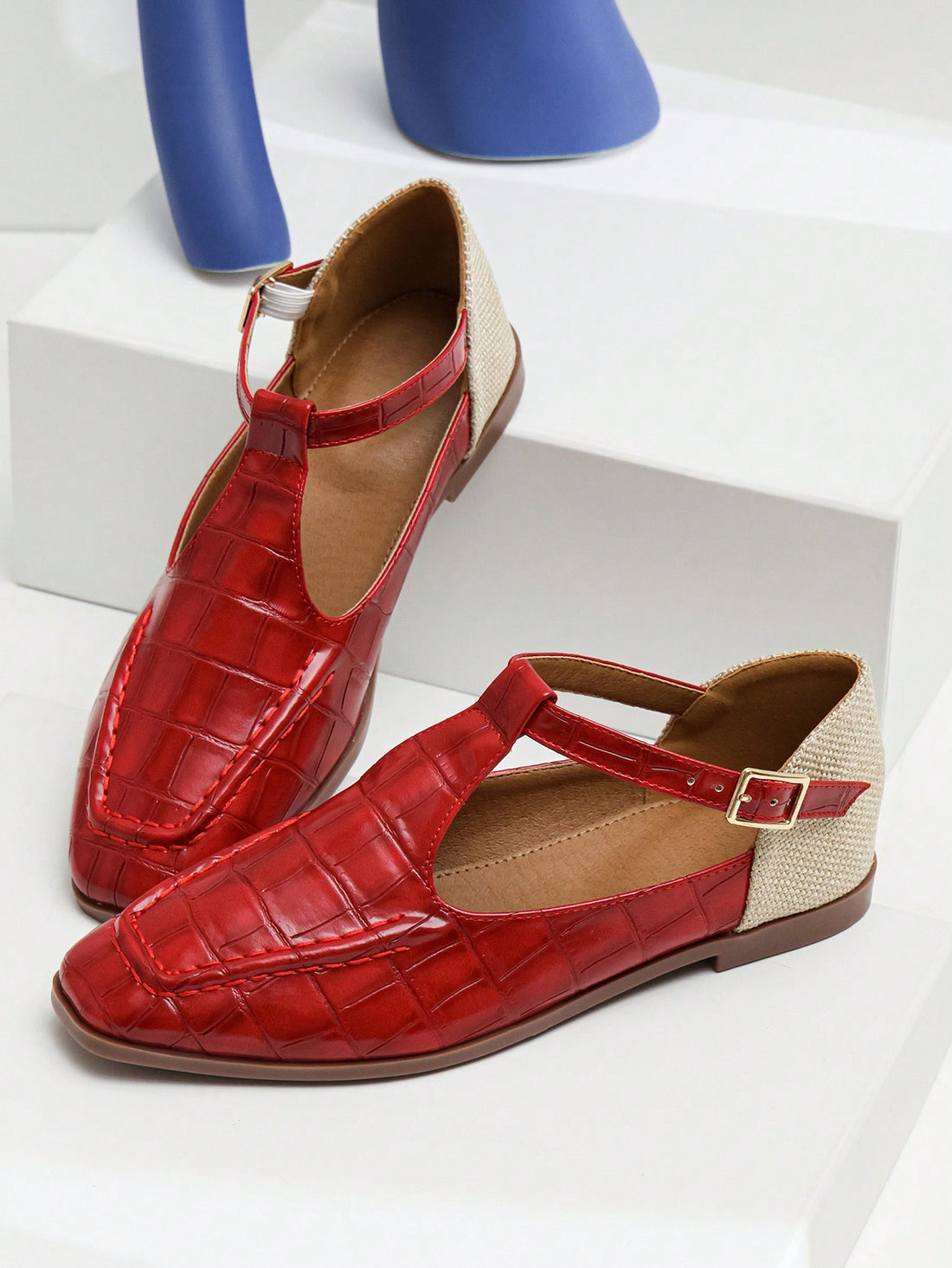 These Ruby Red Square Toe Mary Jane Flats offer a trendy twist on timeless style. Featuring a bold square toe and classic Mary Jane style, these flats are both fashionable and comfortable. Elevate any outfit with these statement flats, perfect for any occasion.