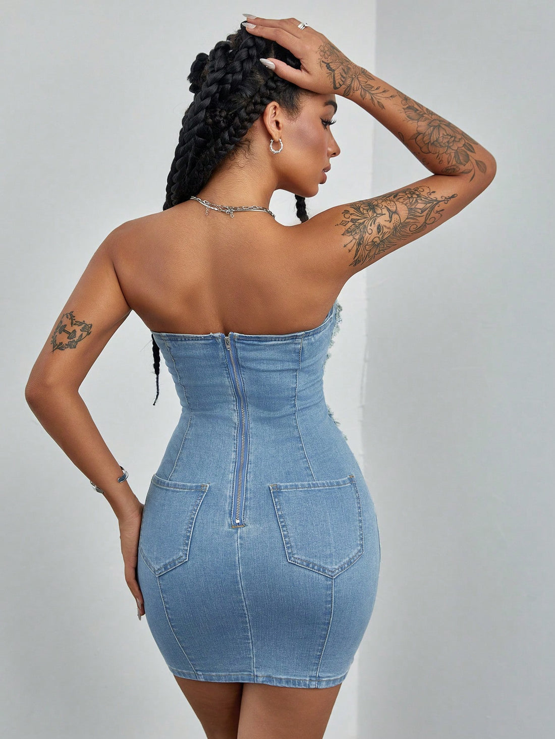 Get ready to turn heads in the Effortlessly Chic Women's Summer Patchwork Ripped Denim Tube Dress. This versatile dress combines style and comfort with its ripped denim design and tube silhouette. Perfect for any summer occasion, this dress will make you feel confident and fashionable!