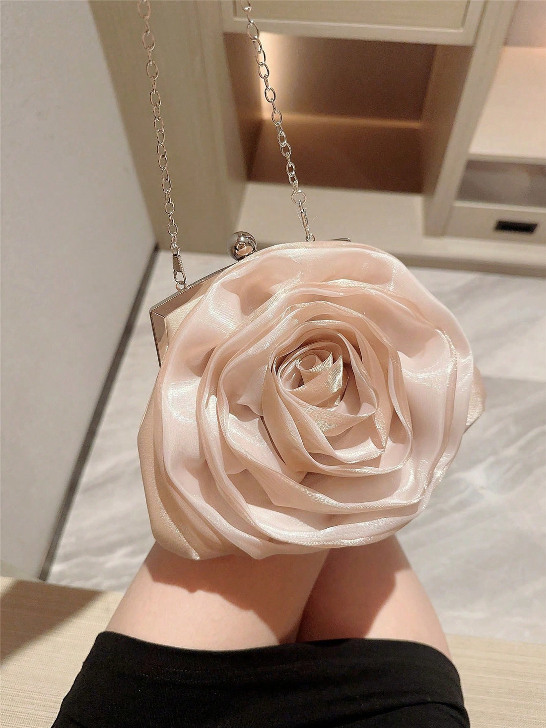 Step into elegance with our Floral Pearl Clutch Bag - the perfect accessory for weddings and evening events. This stunning bag features intricate floral detailing and pearls, adding a touch of sophistication to any outfit. Impress with style and grace.