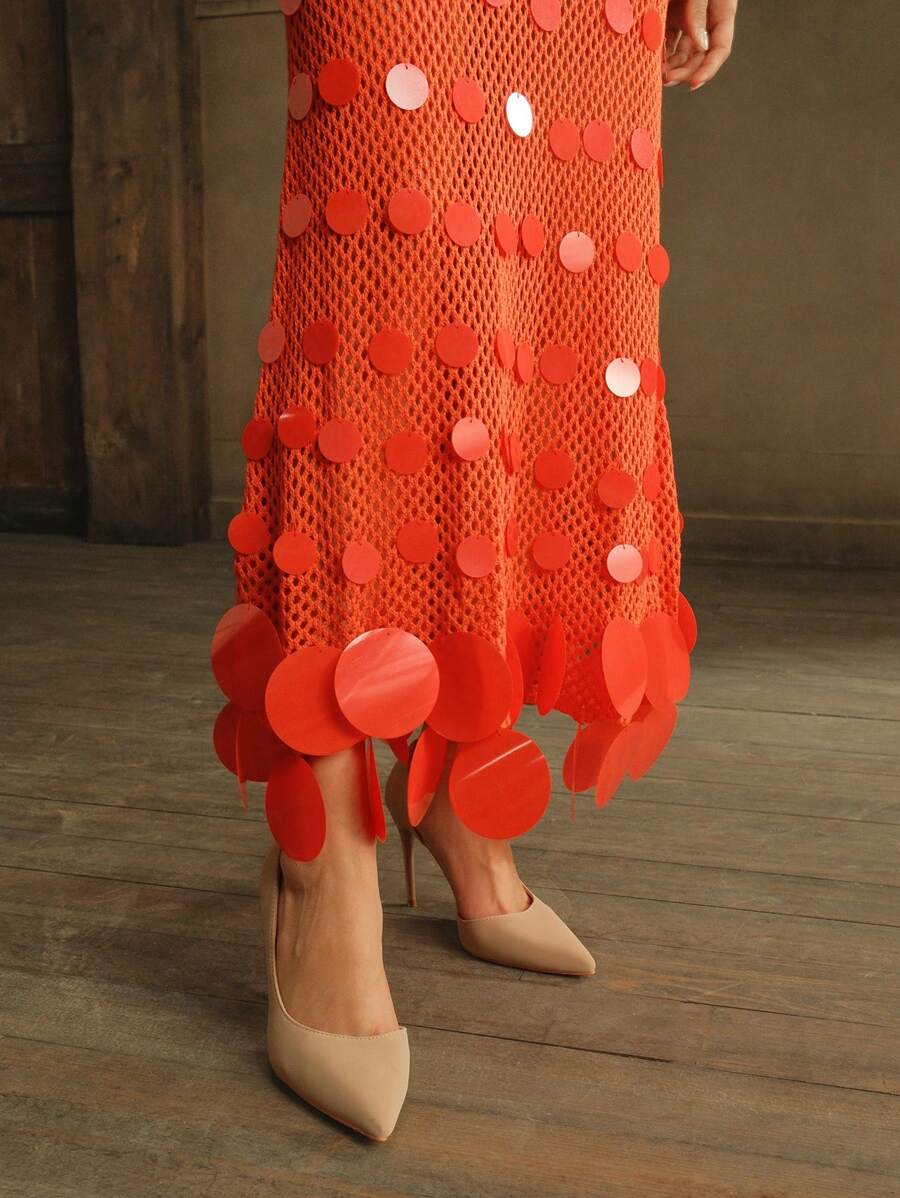Step into the sunshine with this playful red sequined crochet dress, designed to dazzle on your summer beach adventures. Its long sleeves add a touch of elegance while the sparkling sequins catch every ray of light, making it perfect for sunset strolls or beachfront parties. Light and breezy, this dress blends comfort with glamour so you can shine effortlessly all vacation long.