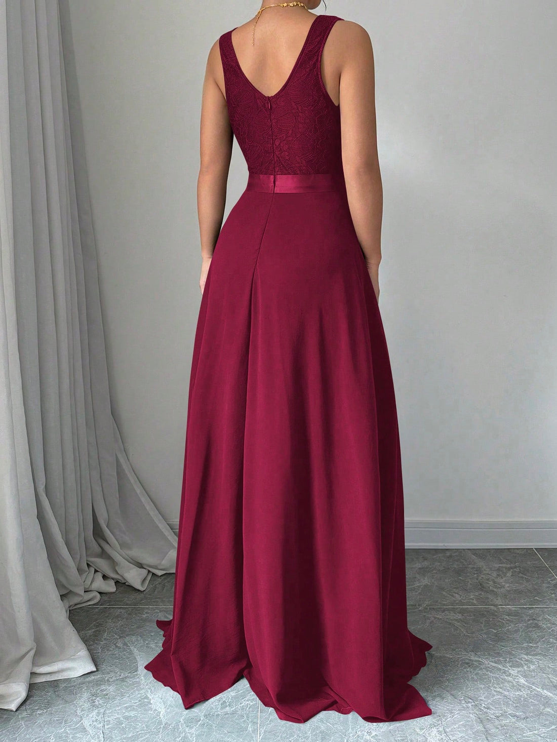 This stunning burgundy maxi dress features a flattering v-neck and elegant pleating, making it the perfect outfit for any occasion. Look stylish and feel comfortable all day with this sleeveless dress. Stand out from the crowd in this uniquely chic and versatile piece.