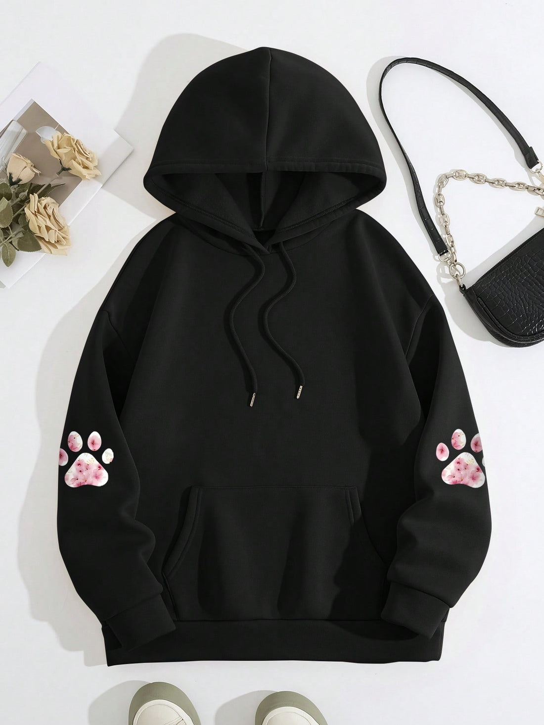 Stay warm and stylish this fall and winter with our Cozy Animal Paw Print Hoodie. Made for comfort and fashion, this chic pullover features a unique paw print design that will make you stand out. Perfect for chilly days, this hoodie is a must-have for any animal lover.