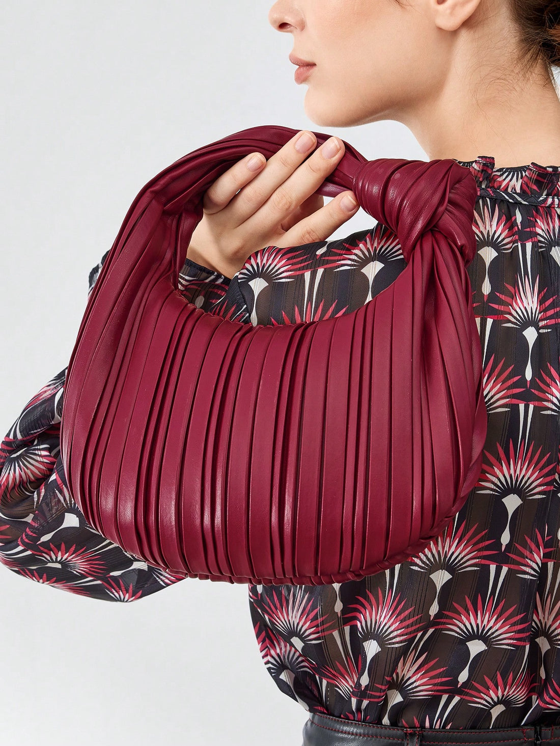 Experience elevated style with the premium Chic Cloud Pleated Handbag. The pleated design adds a touch of sophistication while the solid color allows for versatile styling. Made with high-quality materials, this handbag is the perfect accessory to elevate any outfit.