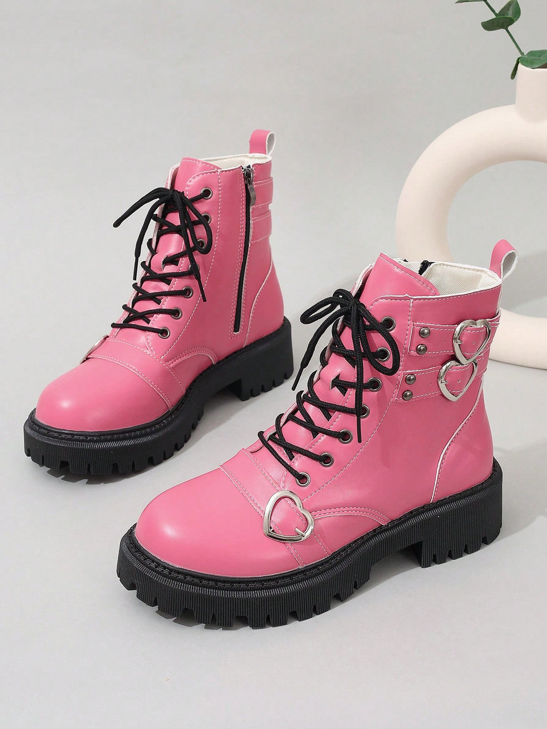 Enhance your spring and autumn wardrobe with these chic and trendy Chic Pink Grunge Punk Studded Heart Lolita Boots. Made with high-quality materials, these boots feature a unique studded heart design that adds a touch of punk and grunge to your style. Perfect for both fashion-forward and edgy looks, these boots are a must-have for any trendy girl.