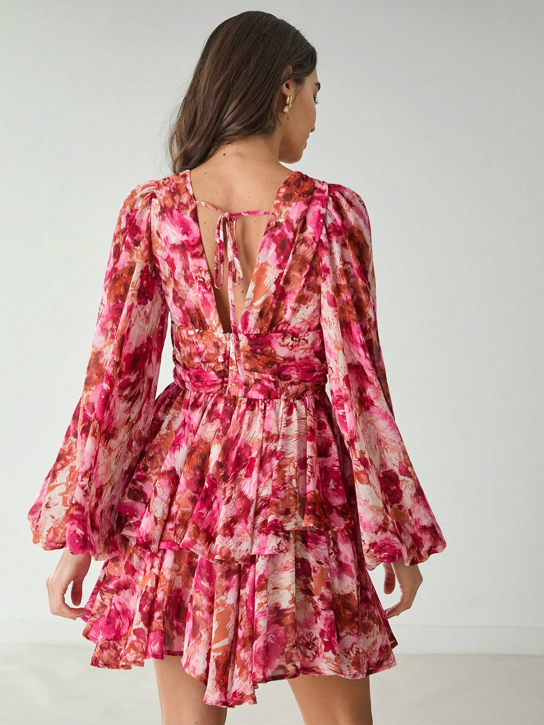 Be the center of attention in our chic floral V-neck long sleeve dress! Whether you're headed to a wedding or a casual brunch, this dress is perfect for every occasion. Stand out in style with its unique print and flattering fit. Make a statement without trying too hard!